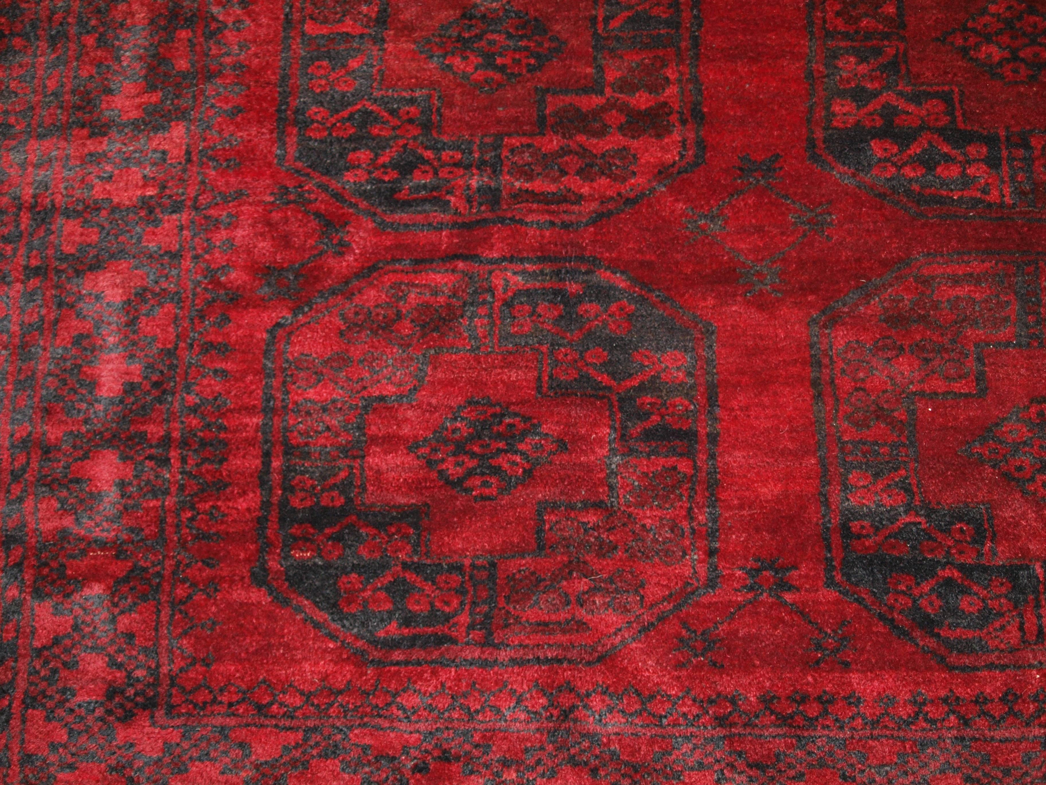 Old Traditional Afghan Village carpet, very deep rich red color, superb condition, circa 1920.
Size: 11ft 2in x 7ft 9in (340 x 236cm).

Old red Afghan carpet with Traditional design, this carpet has superb color with a very good deep rich red and