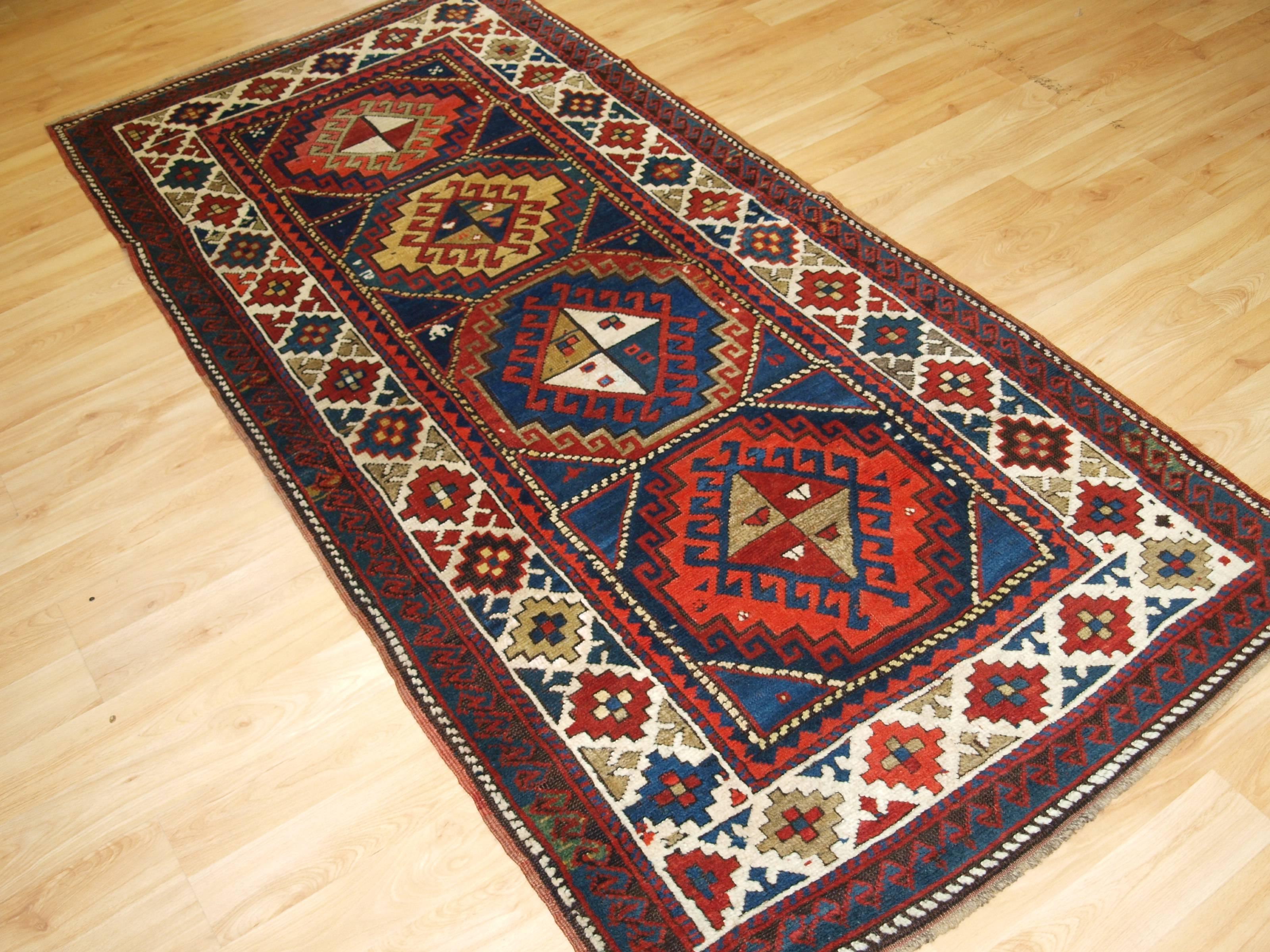 Antique Caucasian Kazak long rug, superb color and design, circa 1900.
Size: 7ft 3in x 3ft 6in (222 x 107cm).

Antique Caucasian Kazak long rug or short runner from the Western Caucasus. 

circa 1900.

A very good example of a Kazak runner or