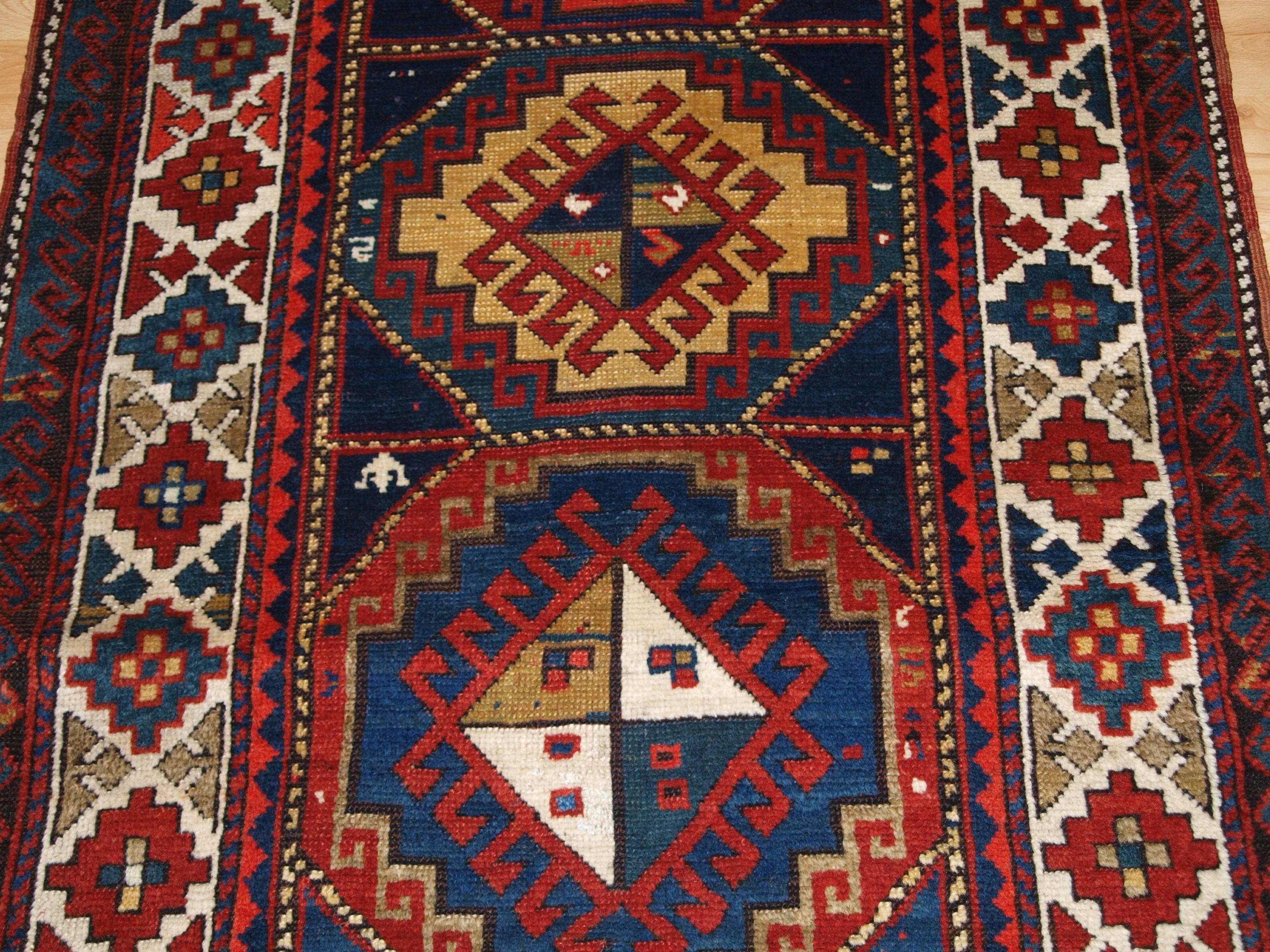 Early 20th Century Antique Caucasian Kazak Long Rug or Short Runner from the Western Caucasus For Sale