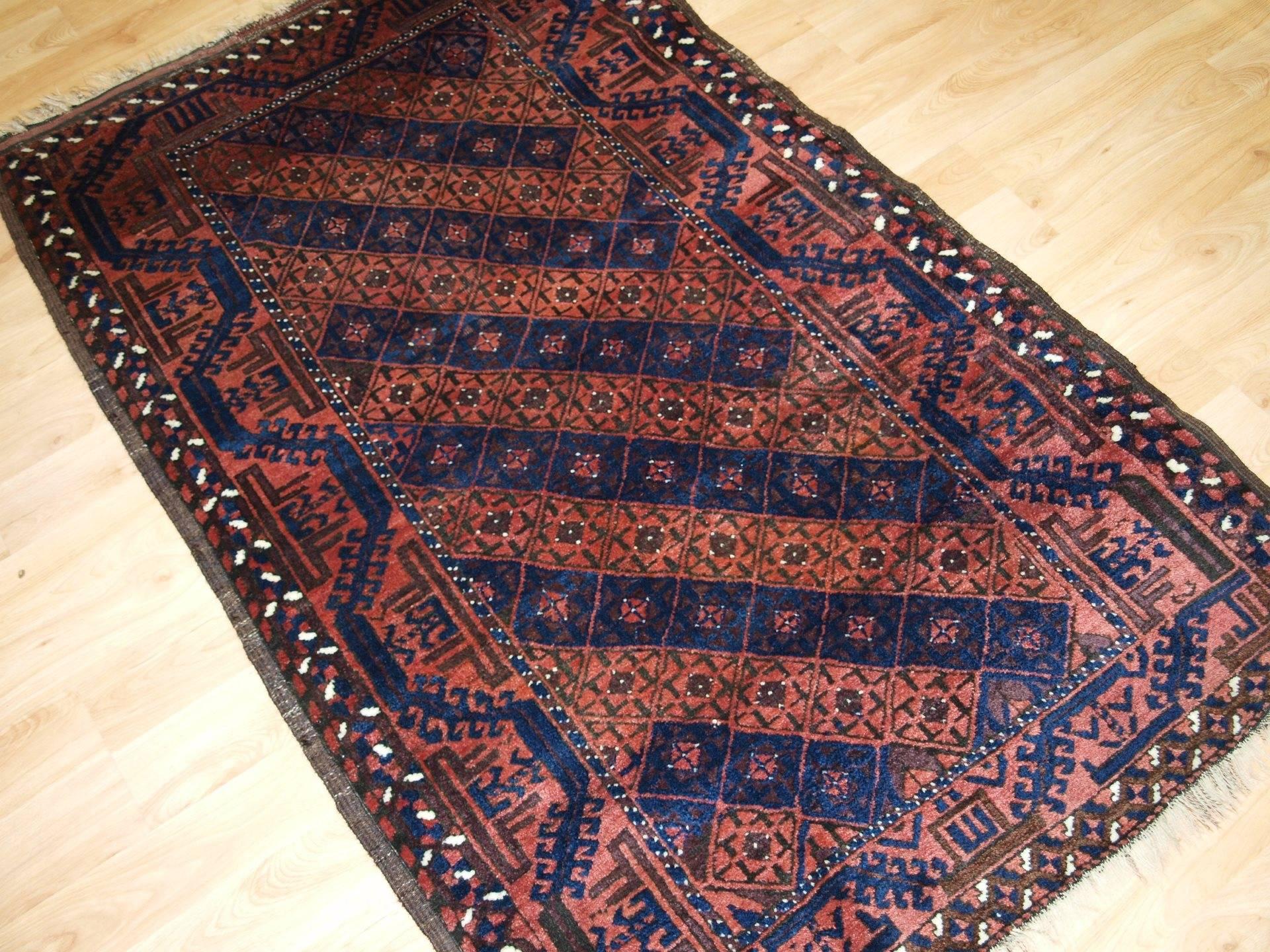 Antique Persian Baluch rug, diamond lattice design, great condition, circa 1900.
Size: 5ft 3in x 3ft 3in (160 x 100cm).

Antique Persian Baluch rug from Eastern Persia. 

  

A good Baluch rug with a diamond lattice design in alternate rows