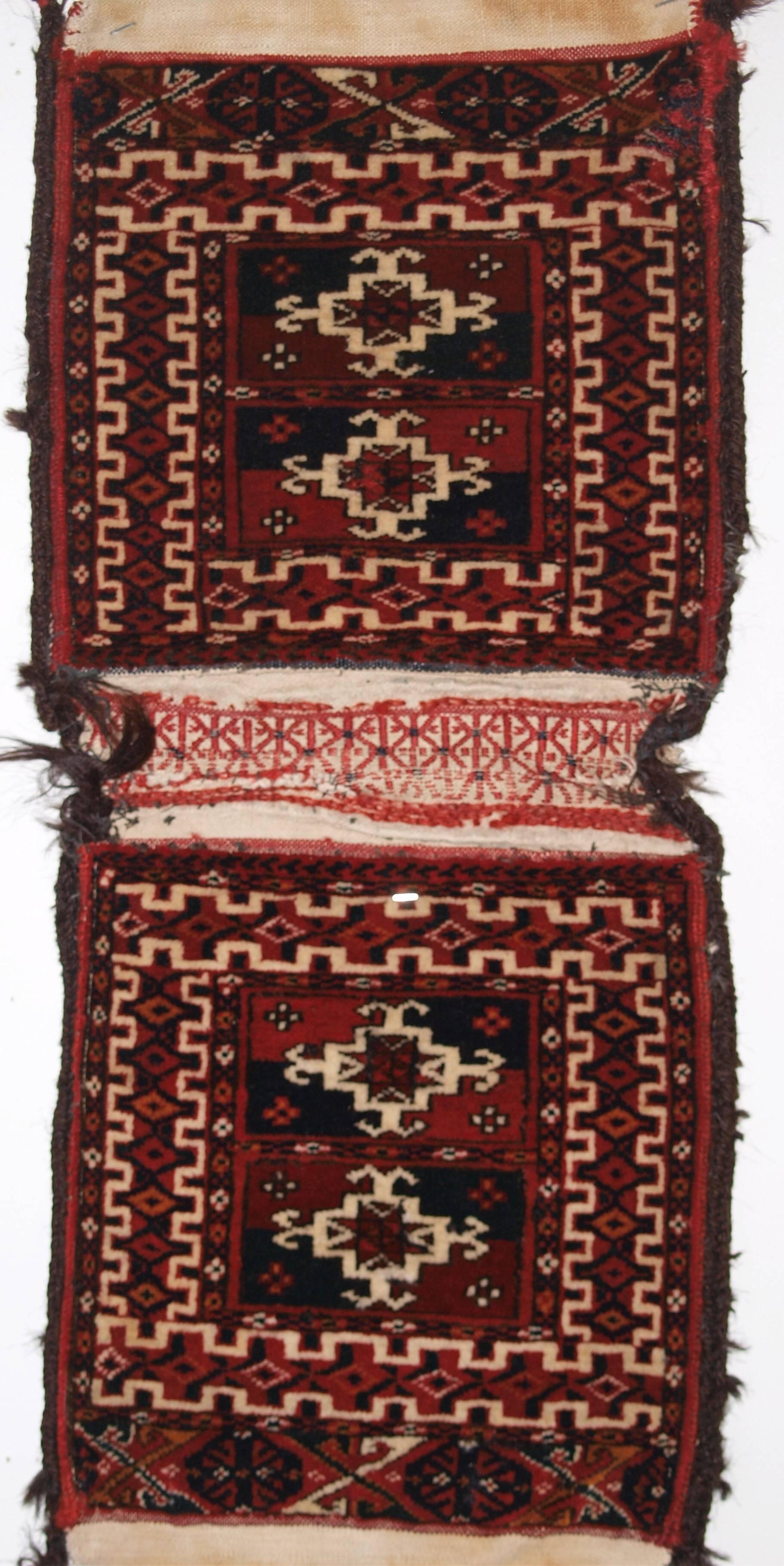 Antique complete pair of very small tekke Turkmen khorjin (saddle bags), outstanding condition, circa 1900.
Size: 1ft 11in x 11in. (58 x 27cm) 

Antique Tekke Turkmen khorjin (saddle bag) of very small size, Southern Turkmenistan,

circa