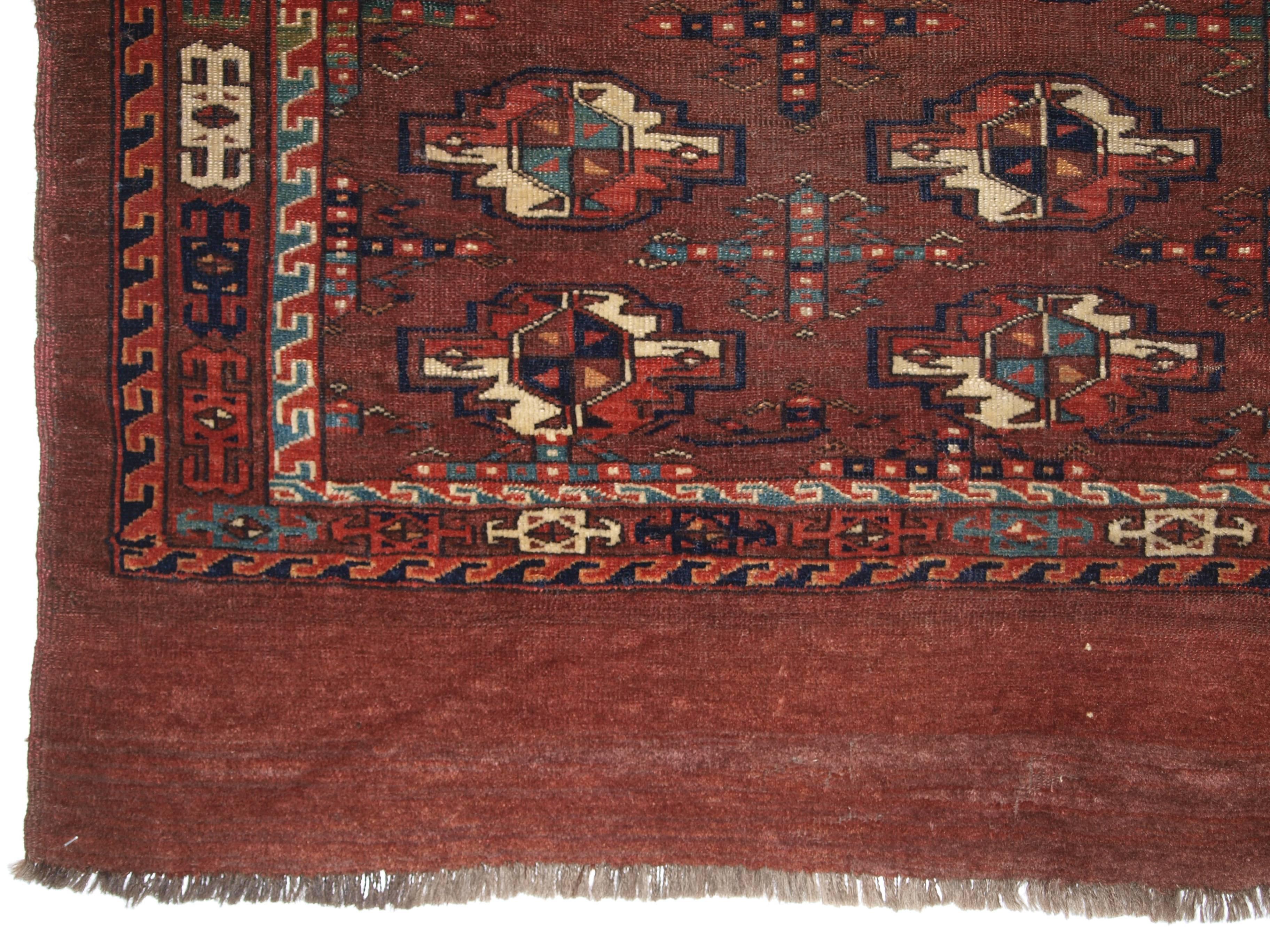 Antique yomut turkmen nine gul chuval, good colour, classic design, circa 1880.
Size: 3ft 10in x 2ft 6in (117 x 77cm). 

Antique Yomut Turkmen 9 gul chuval with good colour including soft greens.

circa 1880.

Very well drawn border with a