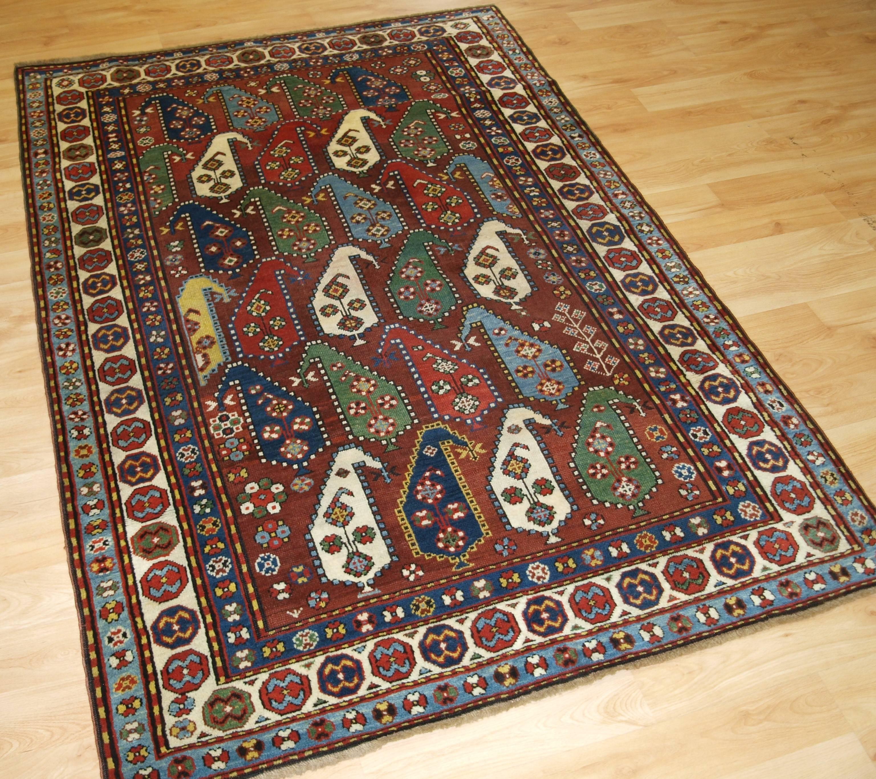 Size: 6ft 1in x 4ft 2in (185 x 126cm).

Antique Caucasian Karabagh region rug with colorful large scale boteh design.

Late 19th century.

A superb example of a Karabagh region rug drawn with very large boteh on a deep burgundy red field. Each