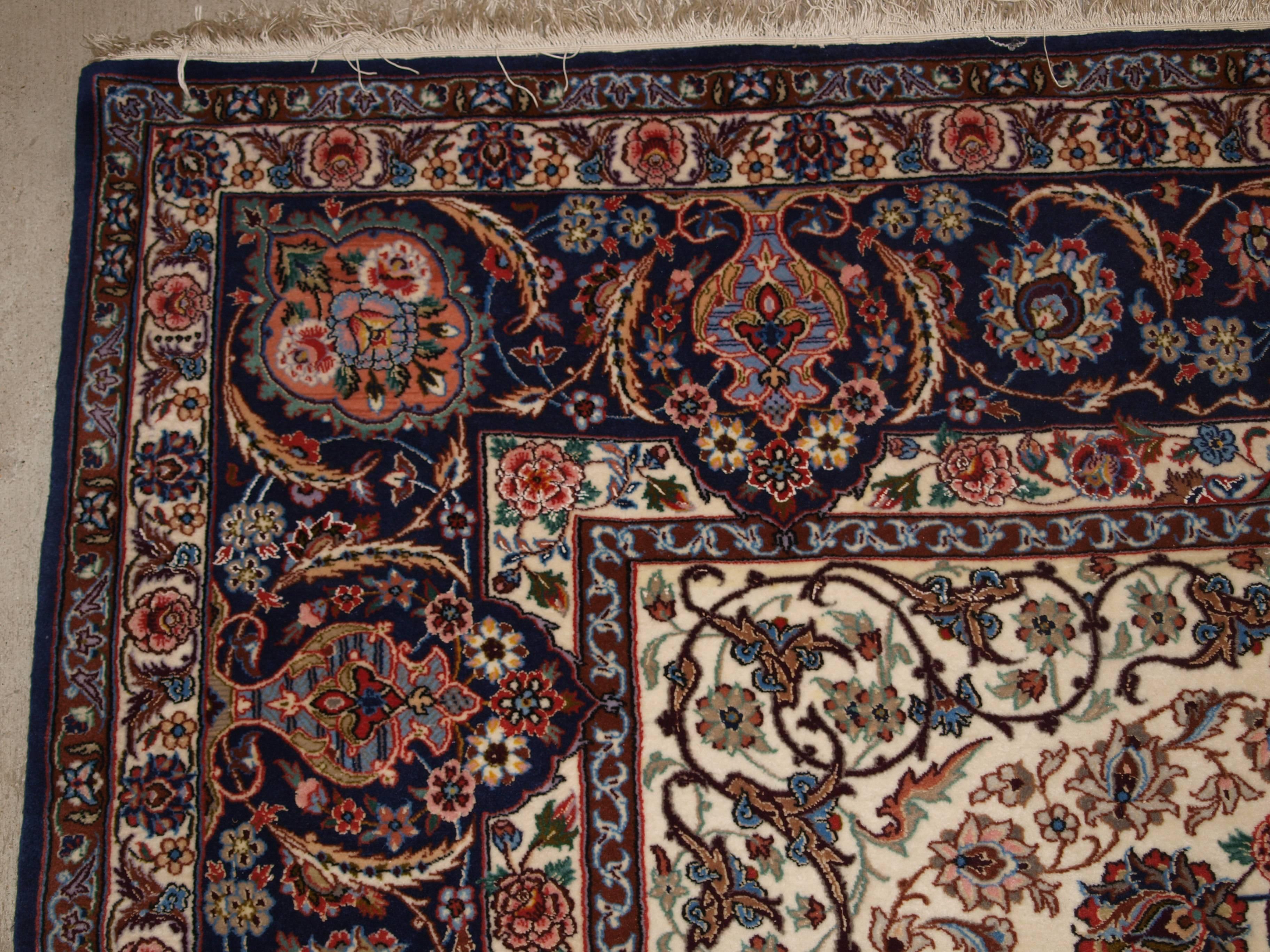 Size:10ft 6in x 6ft 7in (320 x 200cm).

Old Persian Isfahan carpet, wool and silk on a very fine silk foundation. 

About 40 years old.

The carpet is of very fine weave with tight fine pile of lambs wool with silk high lights. The carpet has