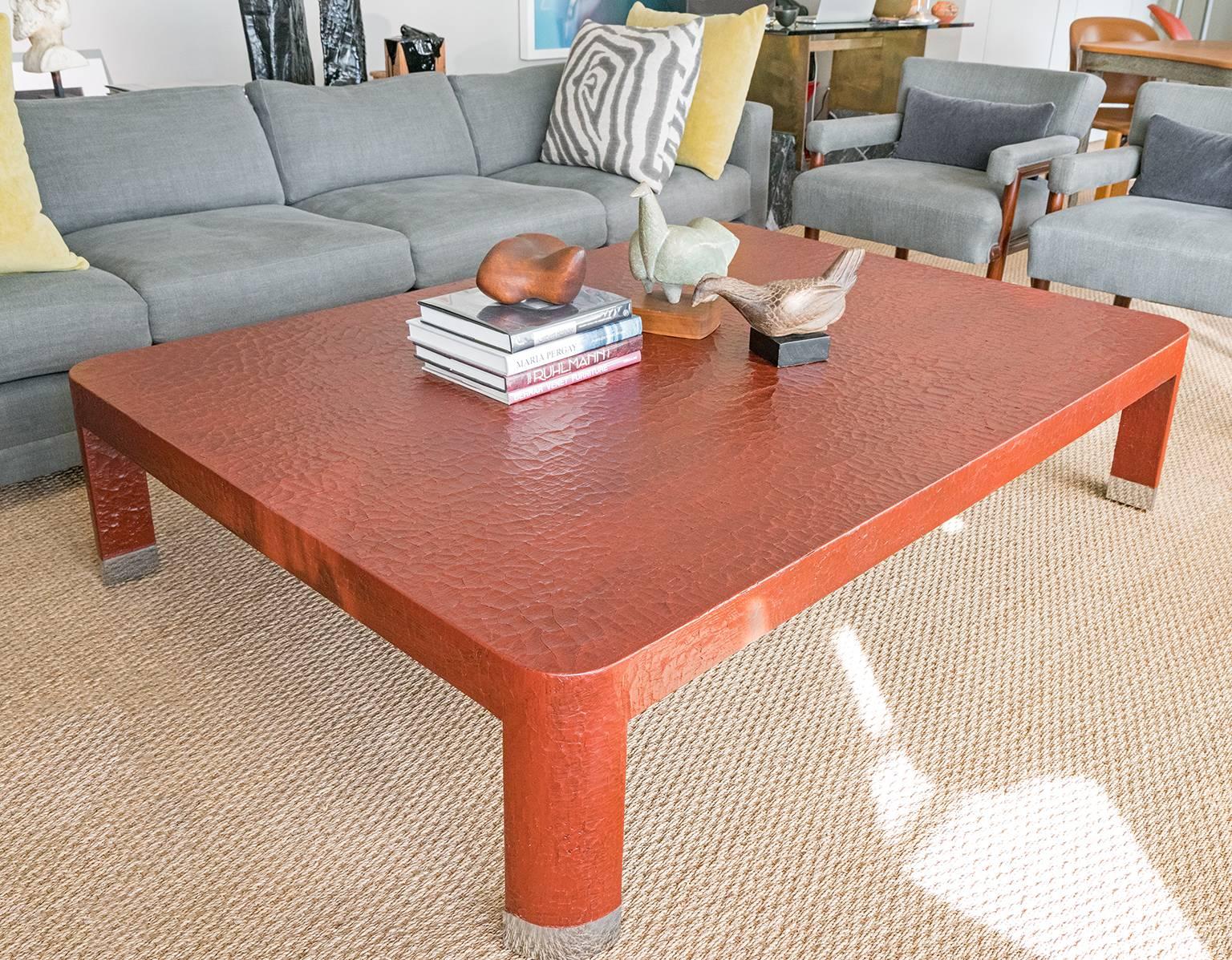 A beautiful crackled linen finish oversized coffee table designed by Karl Springer.
 