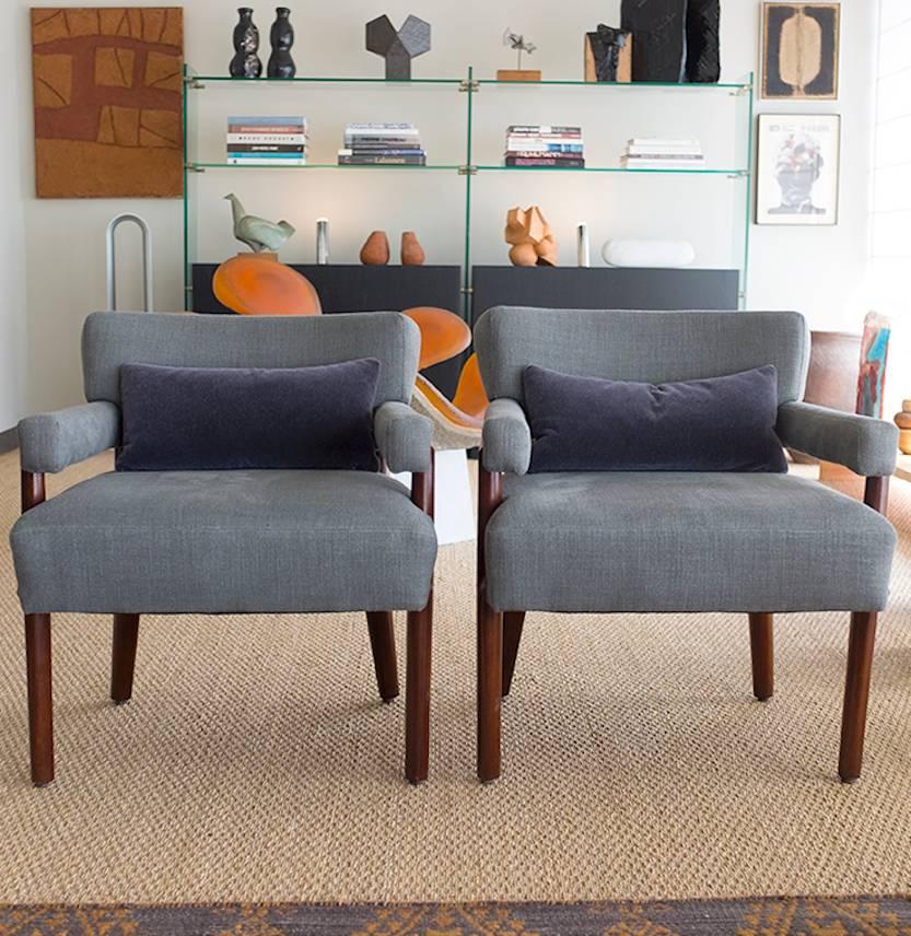 Timeless styling, long, elegant arms. Restored and newly upholstered in Danish grey linen by T.H. Robsjohn-Gibbings (1905-1976) His style is emblematic of a more transitional approach, melding clean lines with classical details.