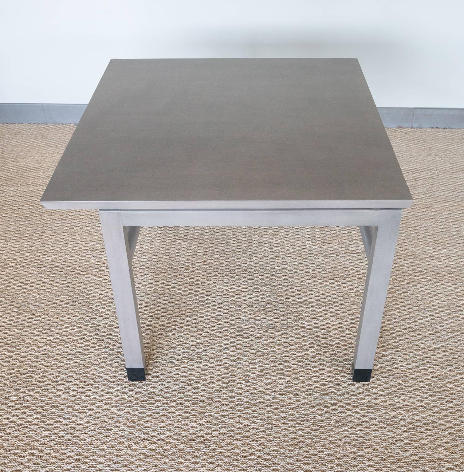 Stunning unusual grey side table with deconstructed element and leather capped legs.