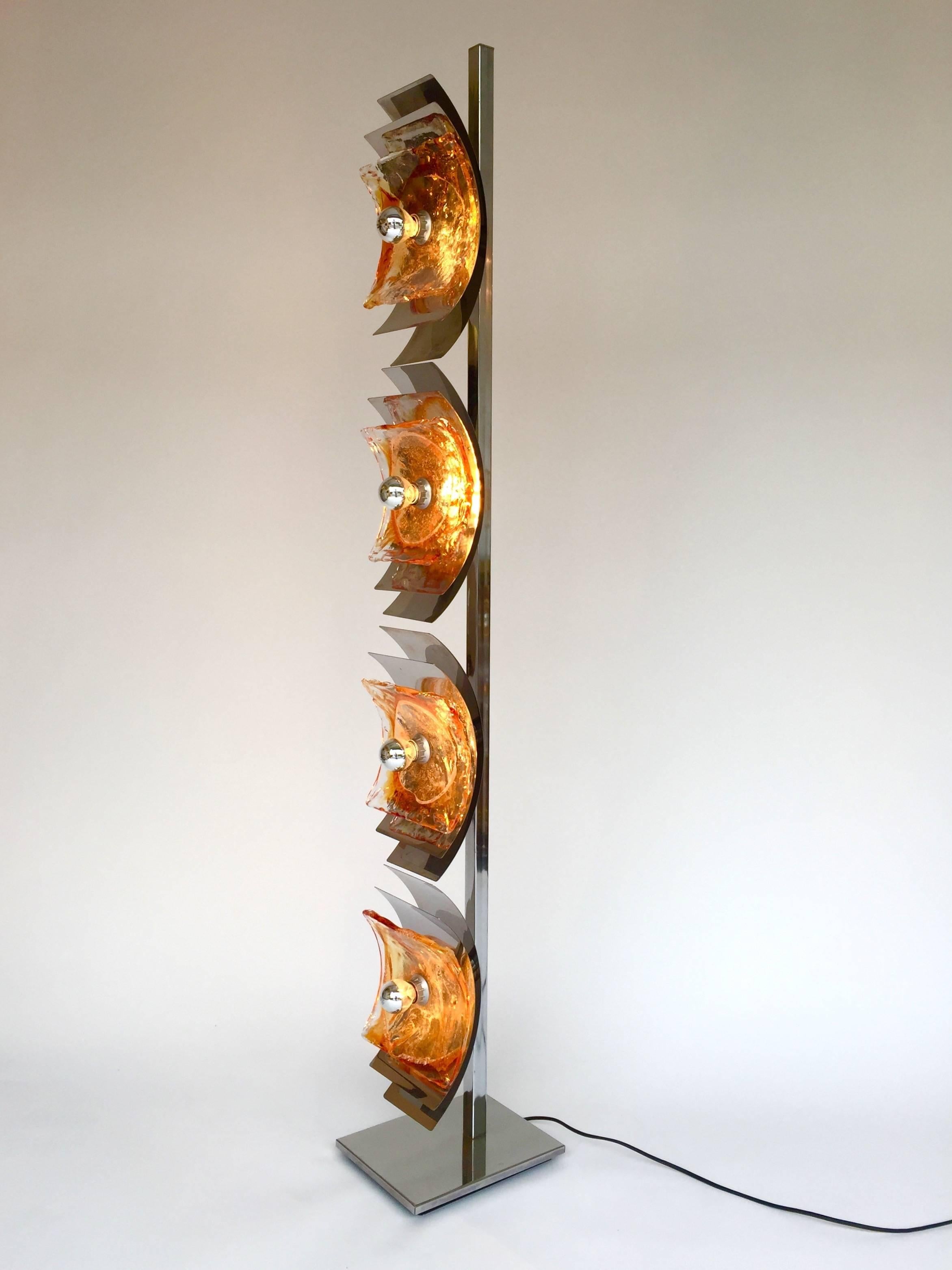 Mid-Century Modern or space age floor lamp in orange blown Murano glass by Toni Zuccheri for the manufacturer Mazzega. Interesting and tall model, an Italian design from the 1970s, 1980s. The glass are mounted on metal chrome orientable blade. This