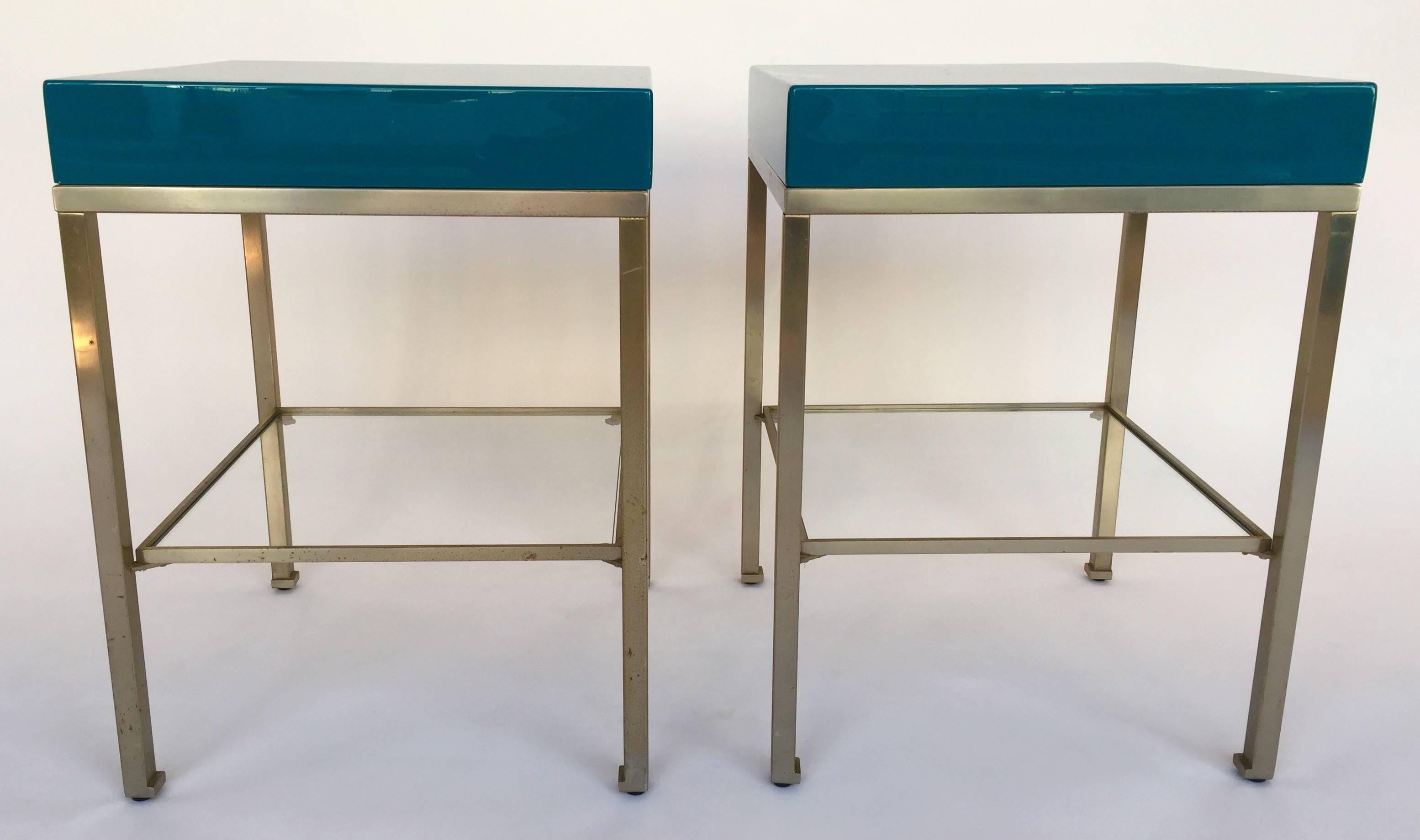 Mid-Century Modern pair of side end tables or nightstands from the iconic model of Guy Lefevre for the Maison Jansen, Paris, France. Rare and beautiful tropical bleu lacquer, interior drawers in wood. Feet in nickeled brass. Guy Lefevre is the best