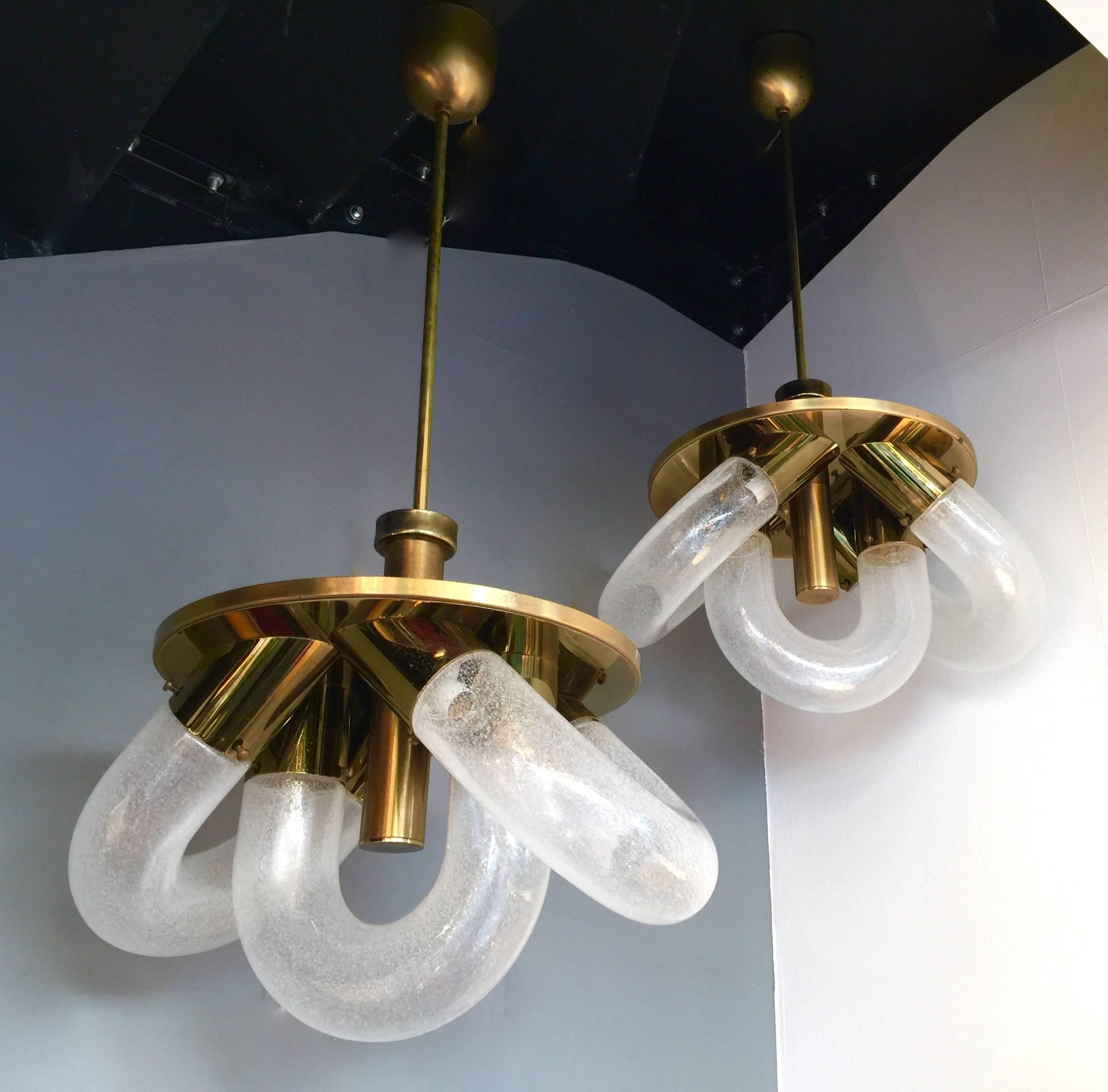 Pair of Chandeliers rare version of a Mid-Century Modern Spage Age ring chandeliers or ceiling pendant light by the designer Carlo Nason for the manufacture Mazzega in Murano blown glass mounted on a rare brass structure. Iconic from the Italian