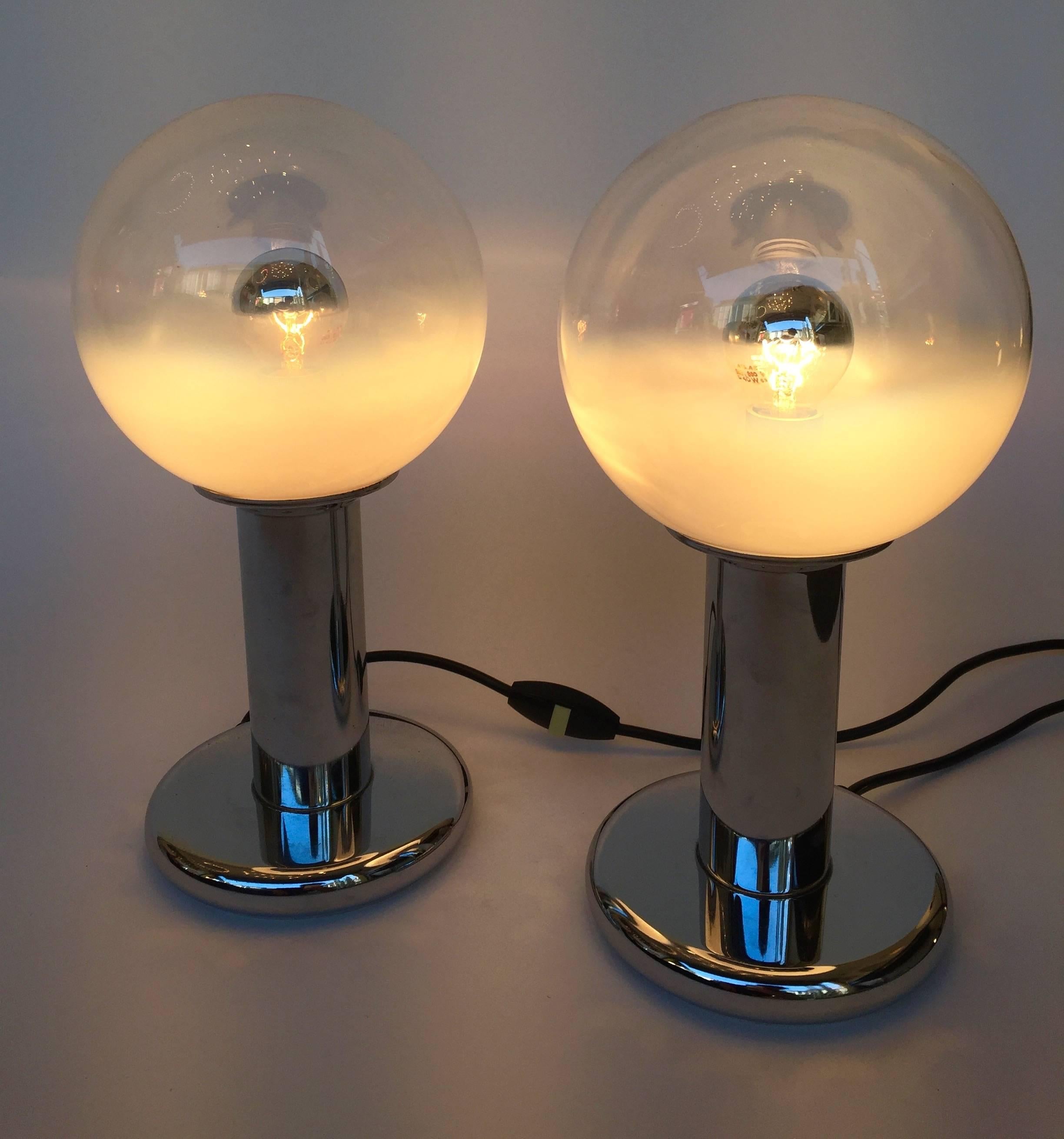 Small pair of table, bedside or desk lamps by the manufacture Mazzega, typical Carlo Nason white smoke blown Murano glass. Metal chrome base. It s a famous manufacturer like Venini, Vistosi, VeArt, La Murrina, Seguso, Artemide in the 1970s-1980s.