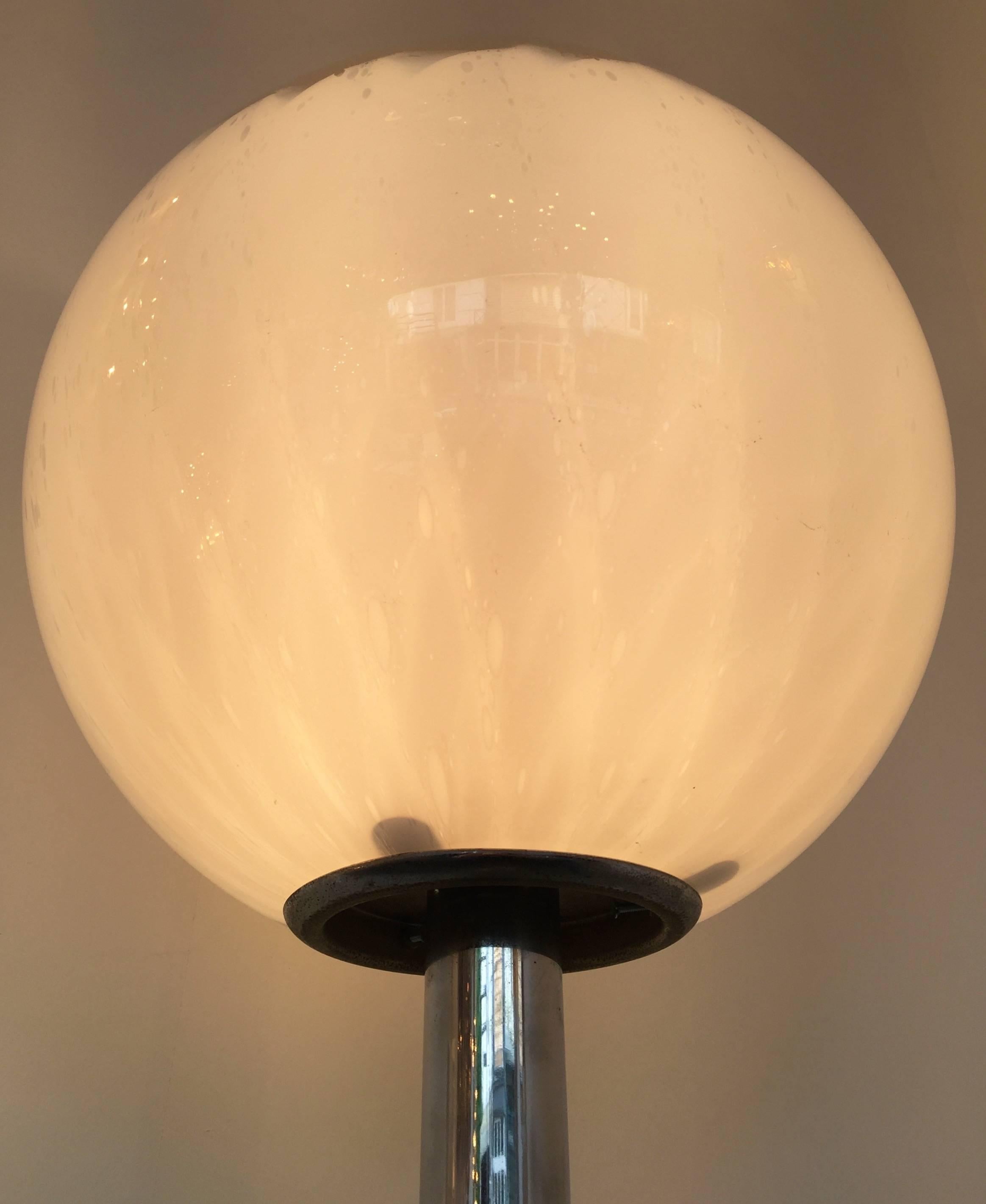 Floor lamp by the editor La Murrina Murano, blown glass ball typical from the manufacture with those bubble in the glass. Chrome structure. Simple and elegant. It s a famous maker like Mazzega, Carlo Nason, Venini, Vistosi, Seguso, Artemide in the