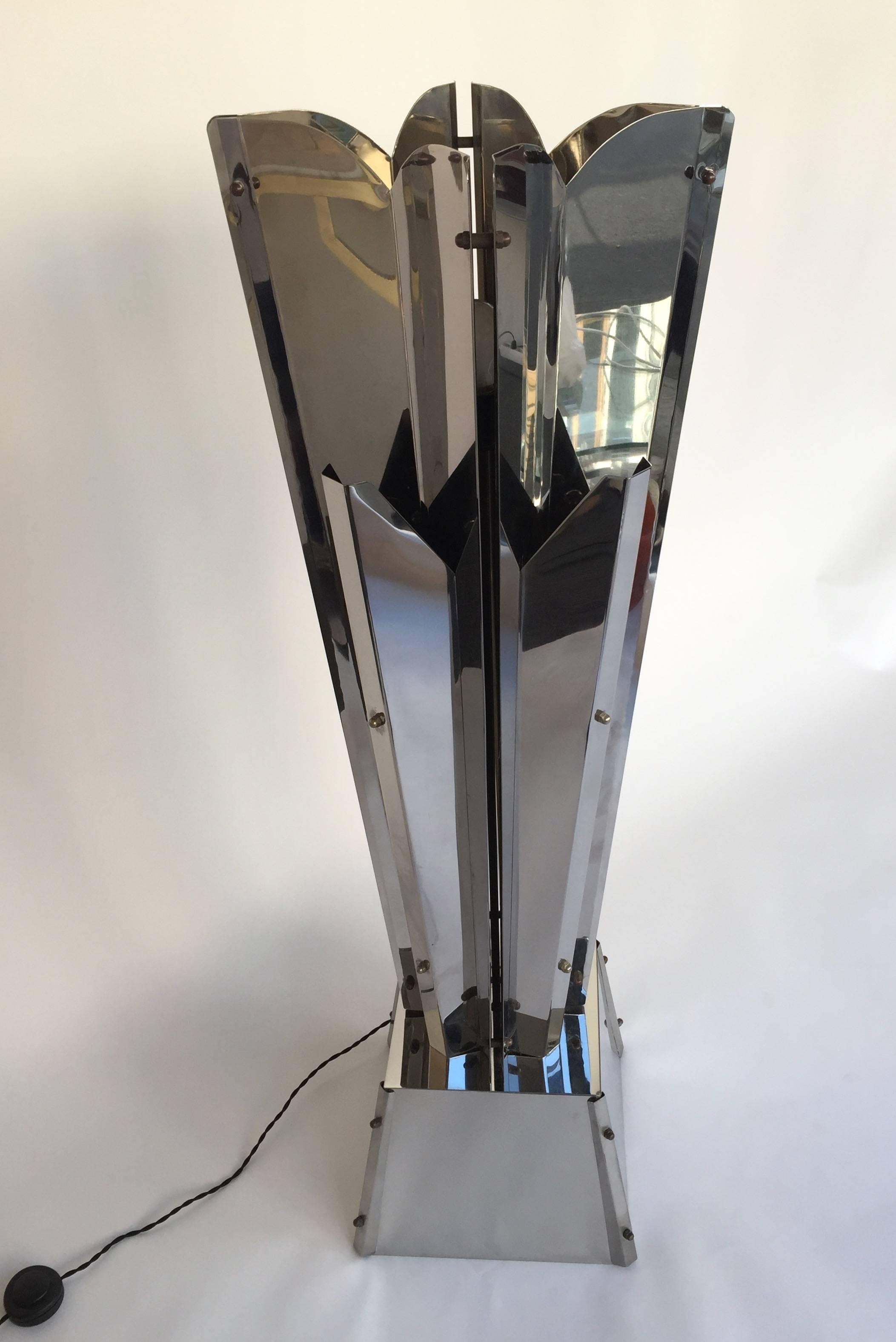 Rare sculptural floor lamp by Reggiani in metal chrome, one central light and four side bulbs. Screwed system typical of Reggiani work. Very impressive and decorative. It s a famous design like Gaetano Sciolari , Maria Pergay , Serge Lebovici in the