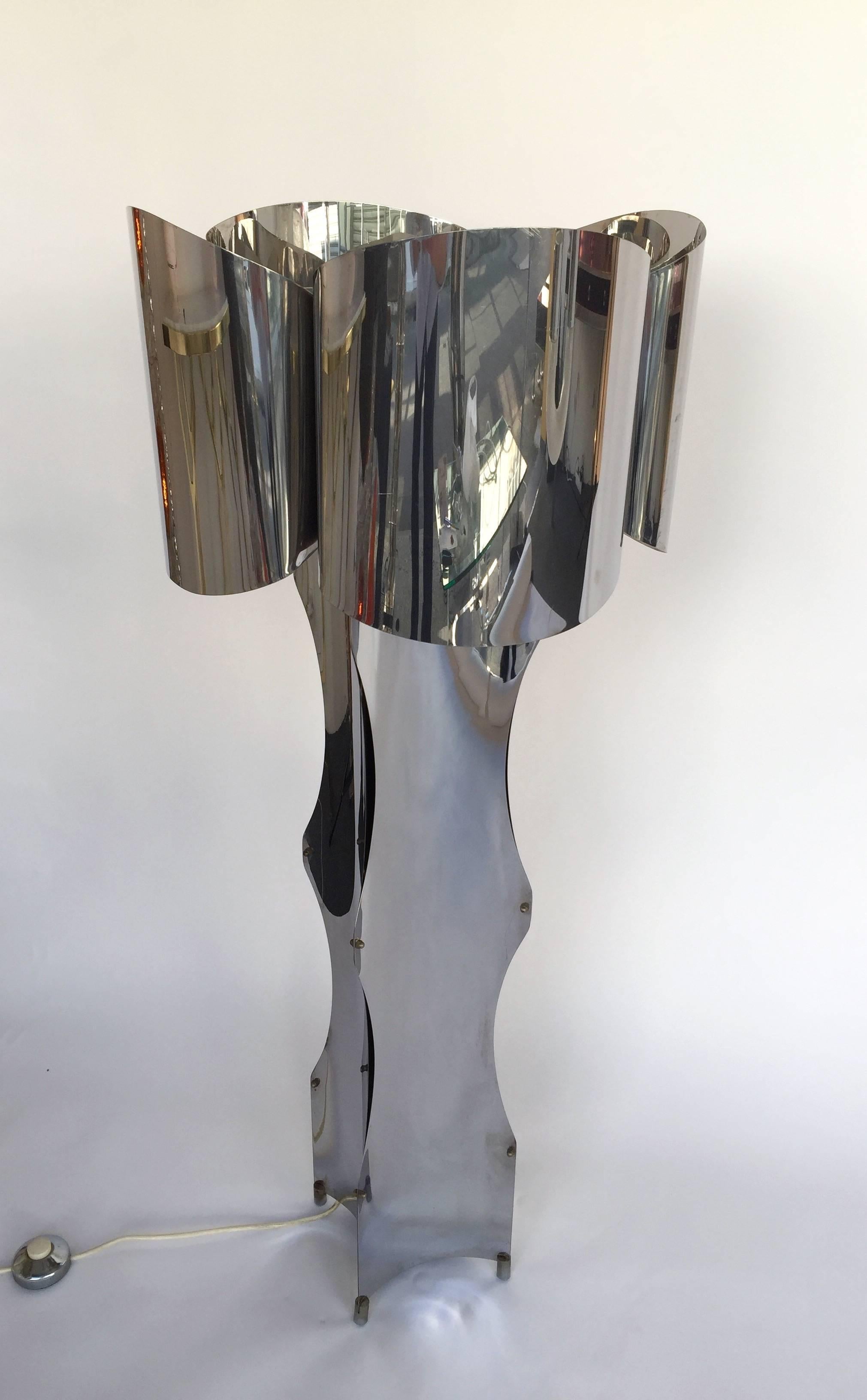 Rare sculptural floor lamp by Reggiani in metal chrome, four bulbs. Screwed system typical of Reggiani work. Very impressive and decorative. It s a famous design like Gaetano Sciolari, Maria Pergay, Serge Lebovici or Maison Charles in the