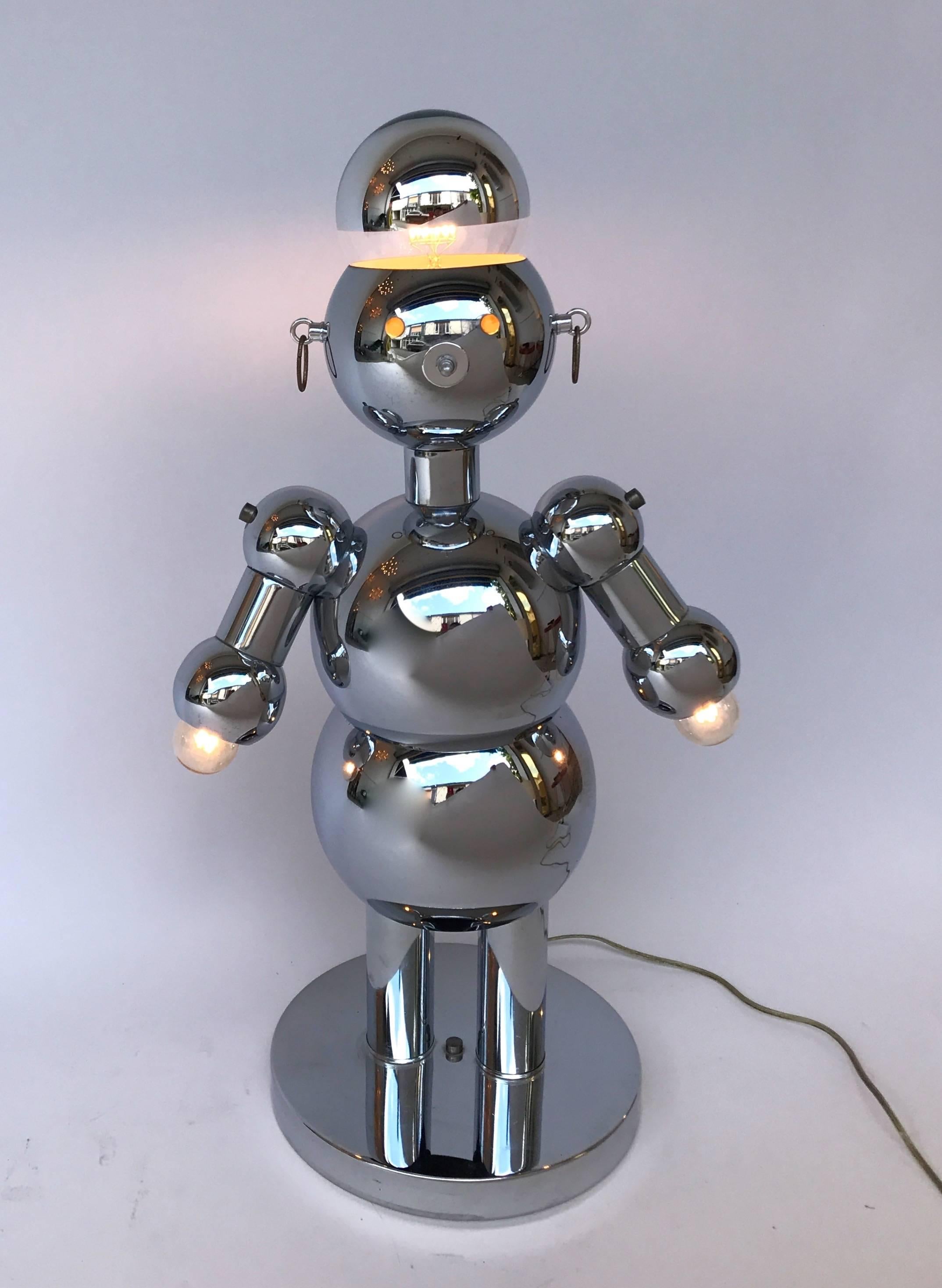 Spage Age female woman robot lamp by the editor Torino lamps from the collection The Robot Family. The nose is the switch light, three-light positions. Nice details like the earrings. Very excellent condition, the chrome is very shine. Famous editor