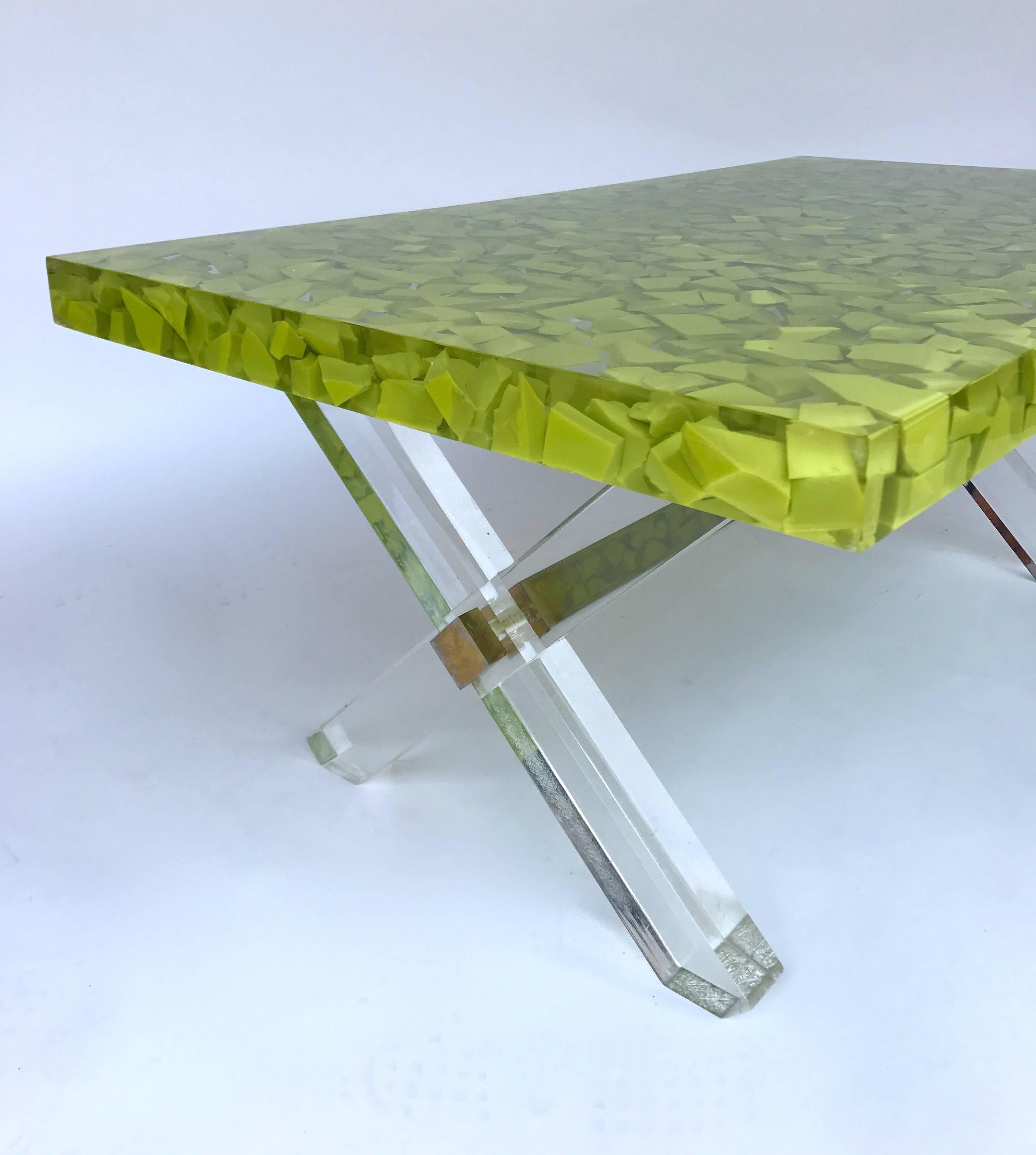 Low coffee cocktail table by the designer Thomas Brant. Nice yellow green inclusion in the resin. Technically interesting and very unusual. 10 Exemplary. Monogramme TB. Lucite base. Different from the fractal resin but can be associate to the Pierre