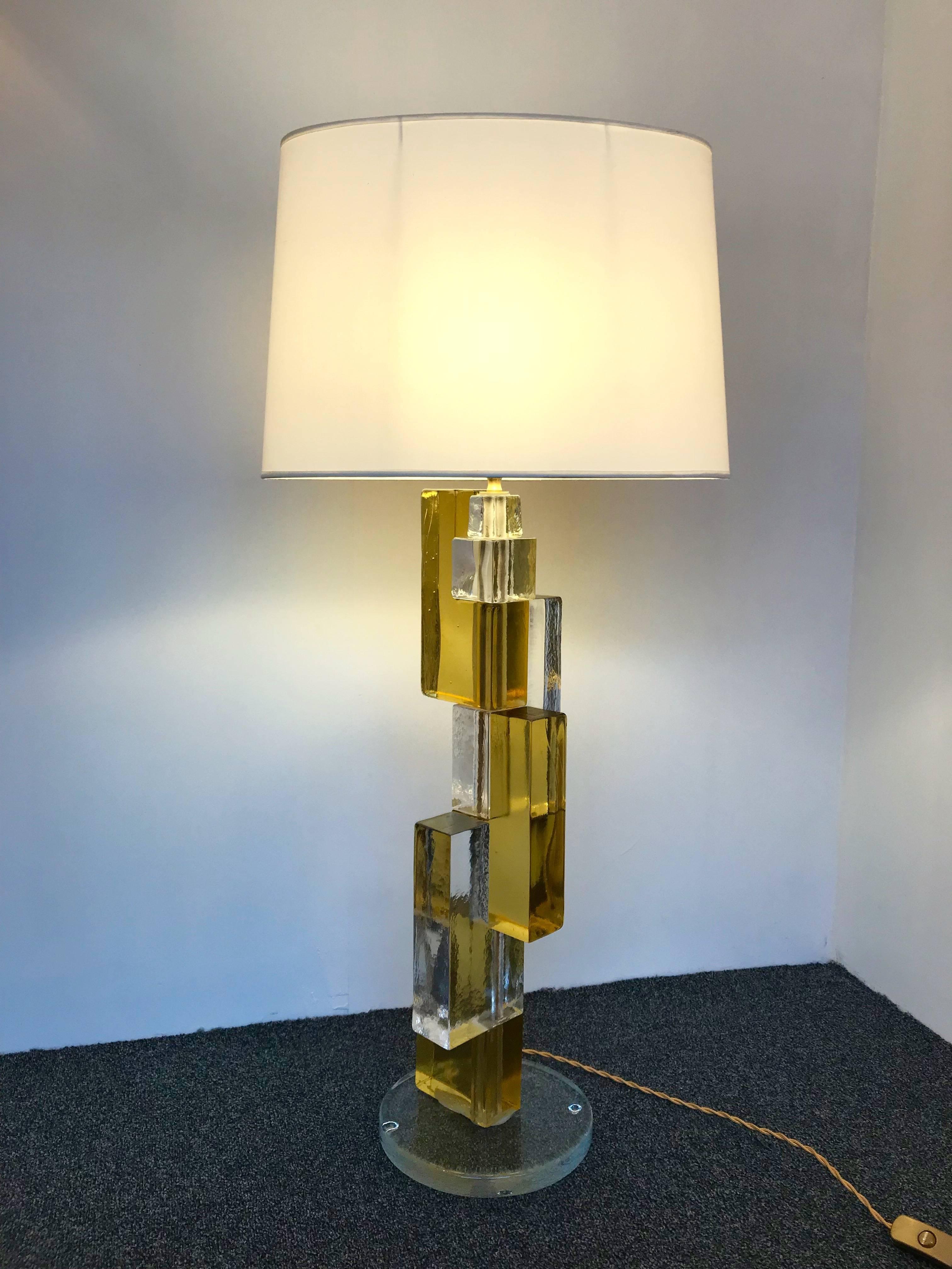 Huge pair of contemporary table lamps cubic pressed Murano glass block. Few exclusive production from a small Italian design workshop. In the style of Mazzega, Poliarte, Venini, Vistosi.

Measure: Height top of lamp 73 centimeters. Demonstration