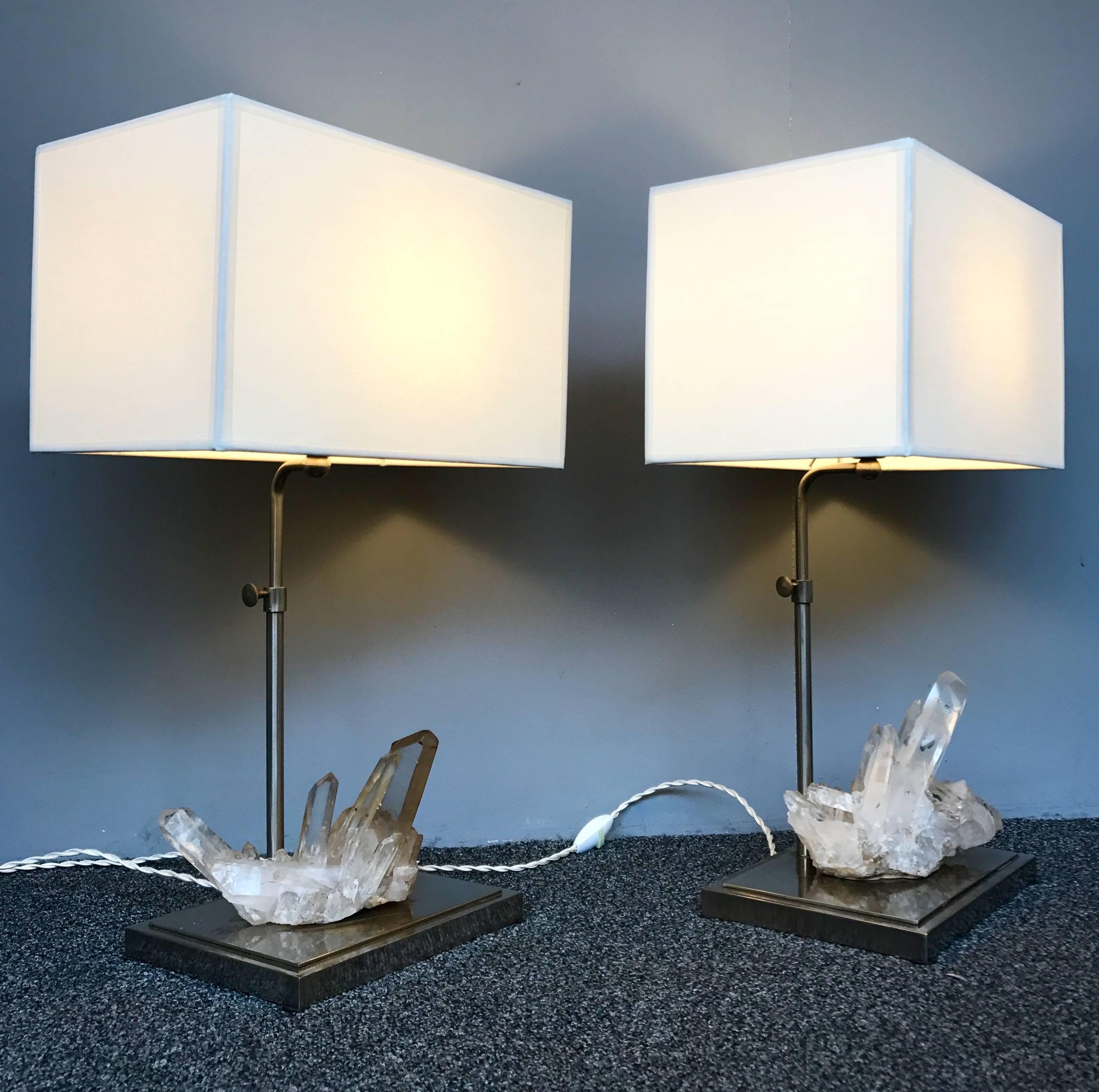 Elegant pair of lamps, nice rock crystal quartz natural stone. Perfect lampshade. Lamps manufacturing typical of the 1970s in a curiosity cabinet spirit. Height adjustable H 60 cms.