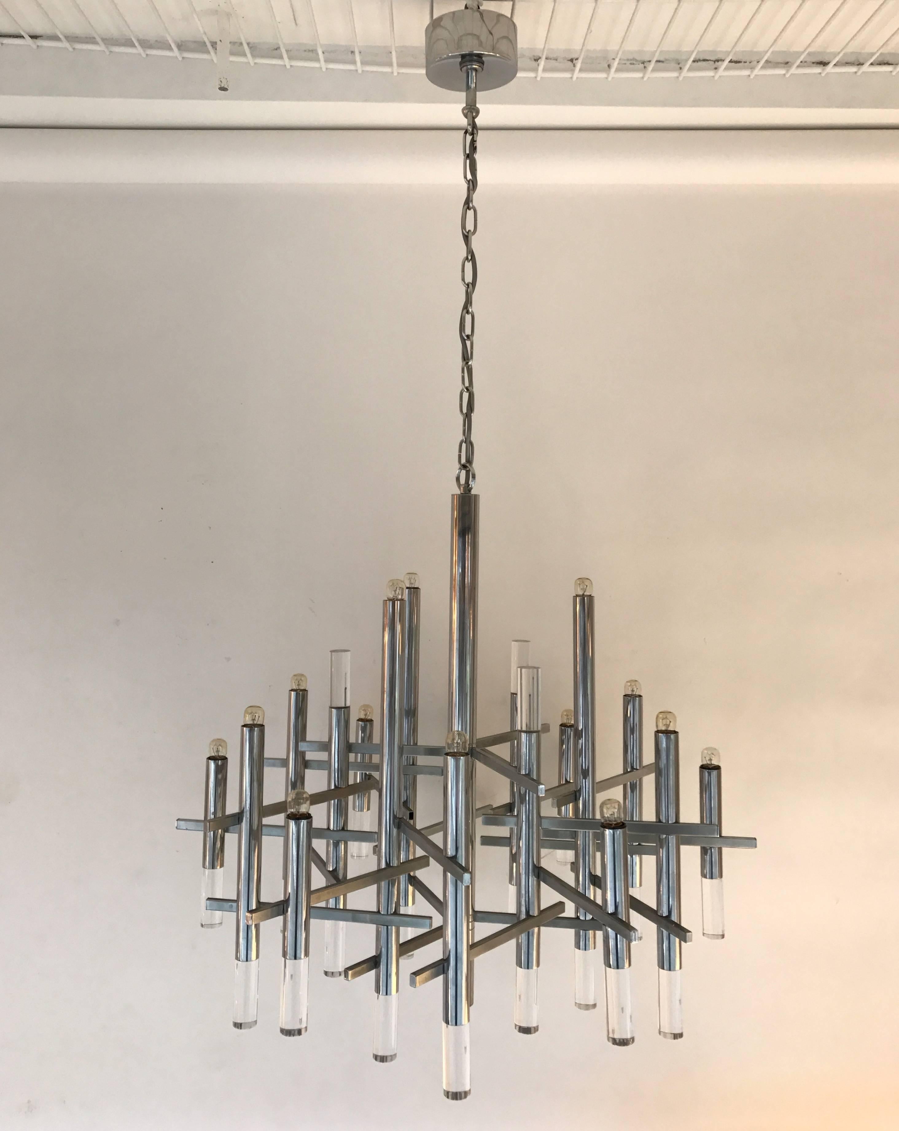 Chandelier or ceiling pendant light by the designer Gaetano Sciolari. Metal chrome and lucite. A futurist model with a touch of neoclassical style. Original Sciolari stamp. Famous design like Reggiani, Hollywood Regency. Easily adjustable in height.