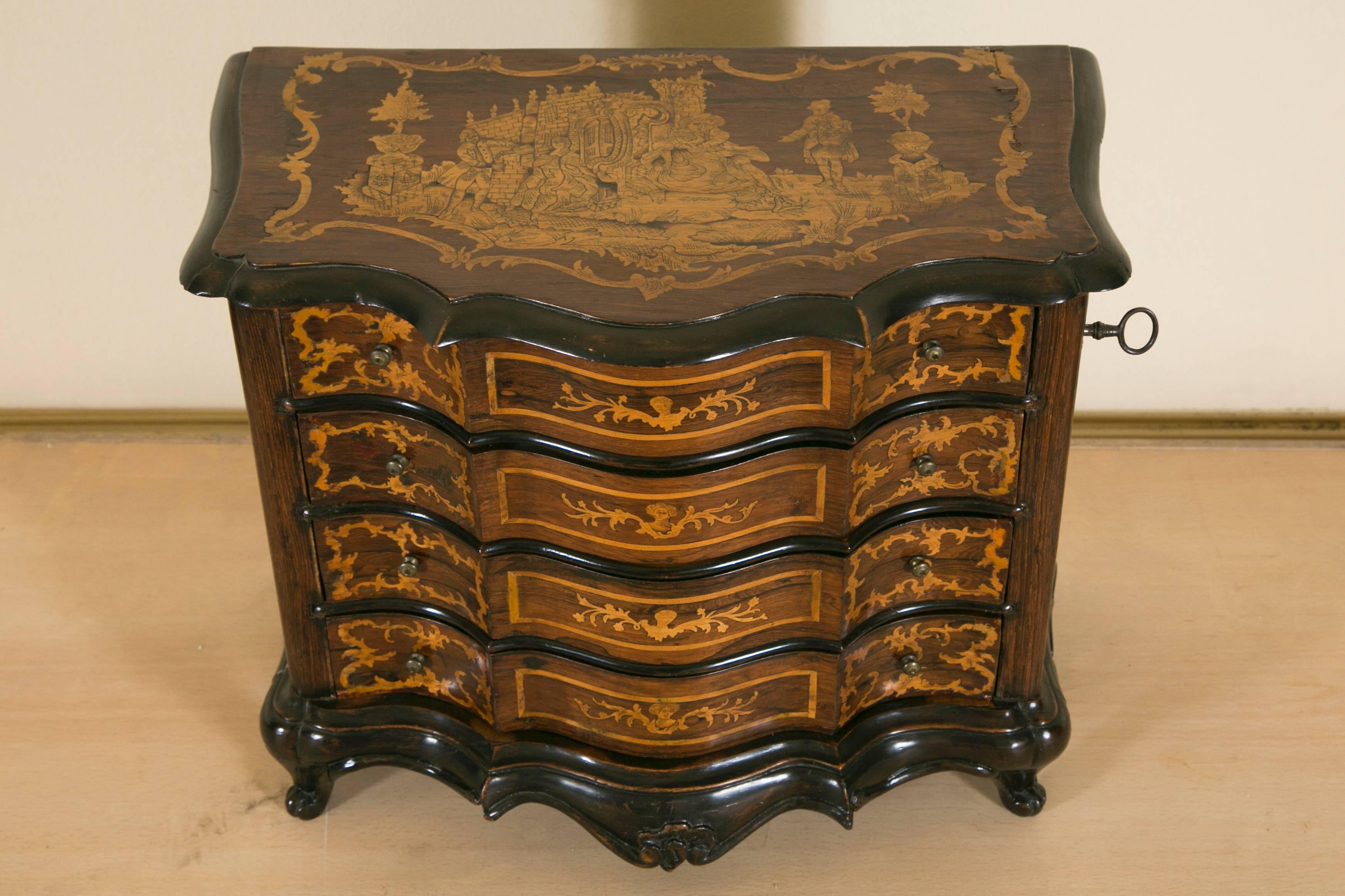 At the end of their apprenticeship, young cabinetmakers had to demonstrate their capabilities by producing a small cabinet. These pieces are always of high quality and achieving many complexities. This chest of drawers is in rosewood veneer and