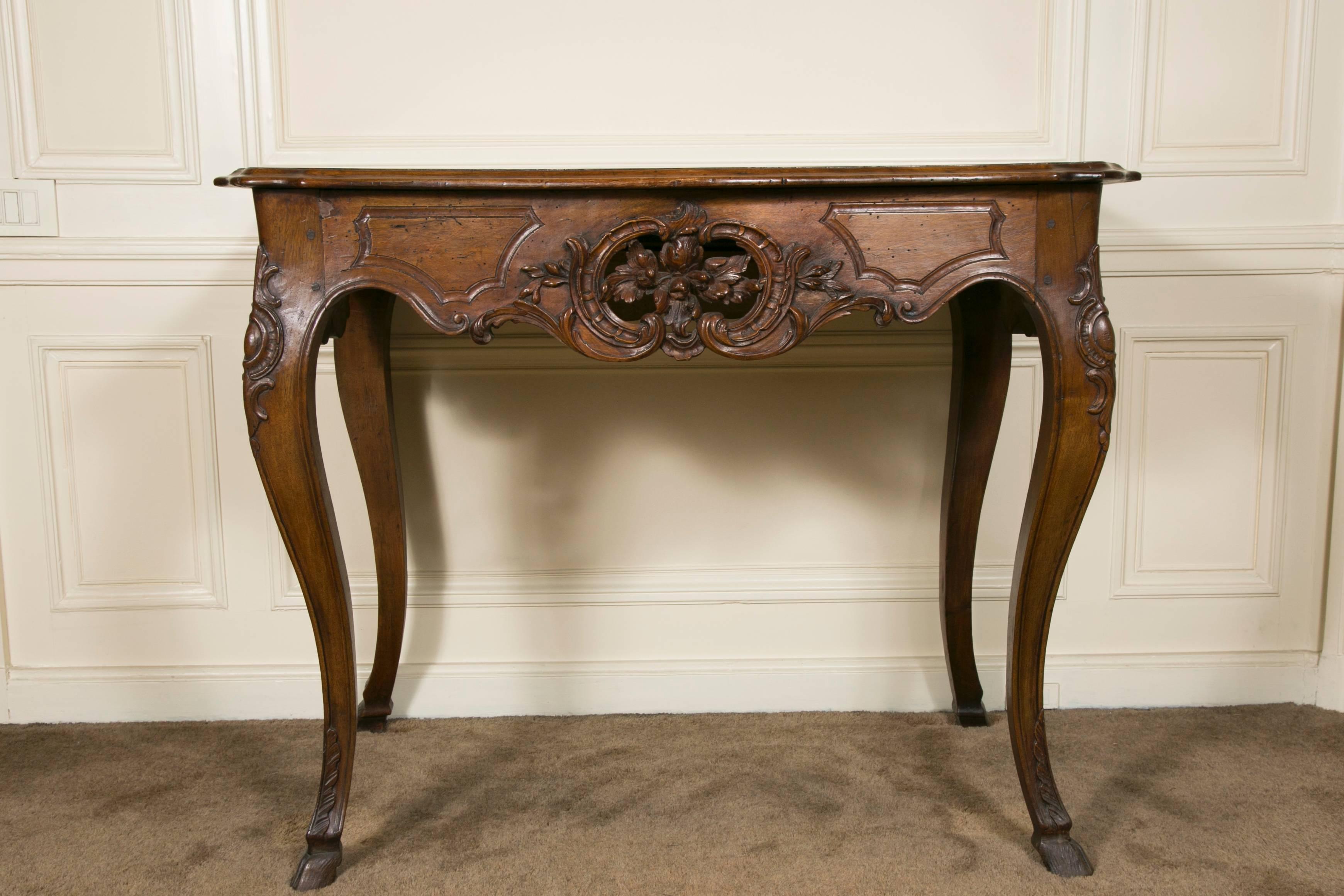 Rare 18th century model console table from Avignon (South of France). Cabriolet legs terminated with hoof feet with a drawer on one side. Wooden top. Very nice open work carving throughout the front belt.