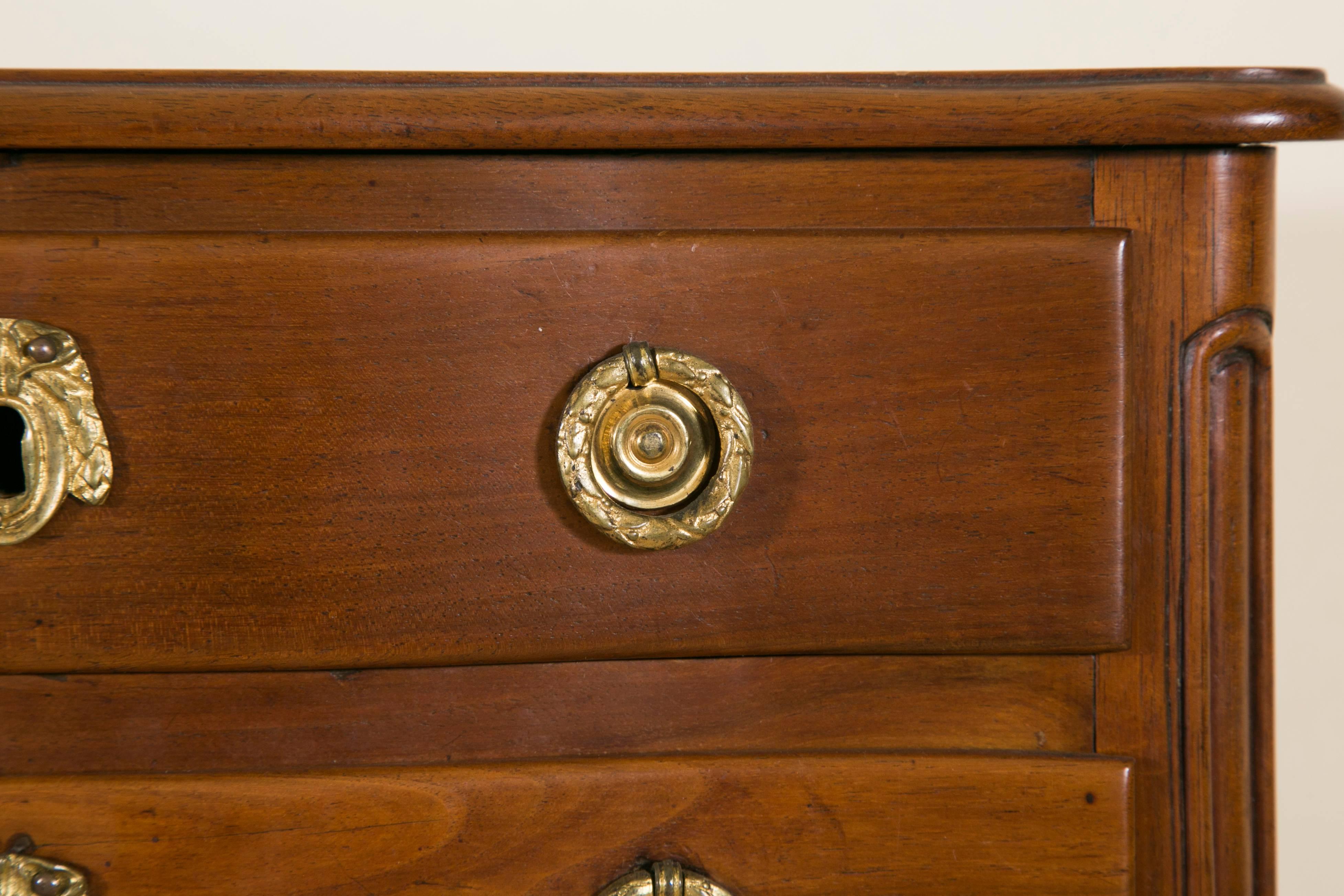Sherry wood commode, serpentine front, three drawers bronze handles early 19th century.
Since the middle age, young cabinetmaker to become master, had to produce a 
masterpiece to show to a Masters Corporation Jury. 
 They are rare and an example