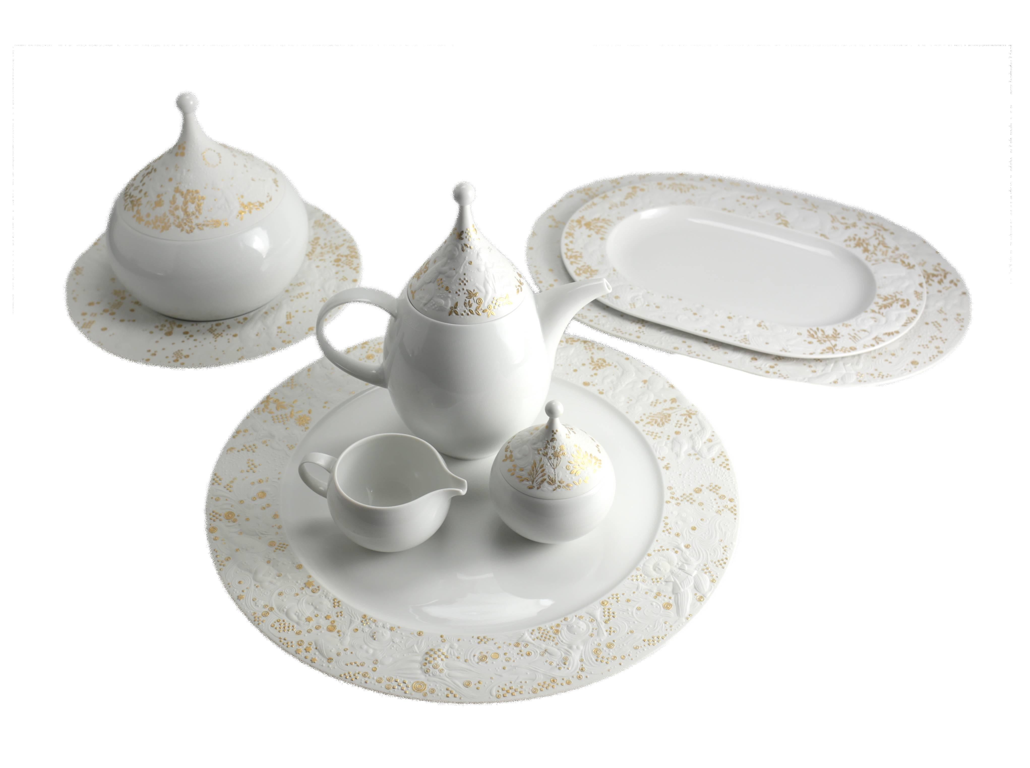 A beautiful and elegant porcelain dinner and coffee service for eight in the Monogramstanos Magic Flute pattern by Rosenthal Germany, designed by Bjorn Wiinblad. The white ground china has subtle gilt highlights, one of five variations of this