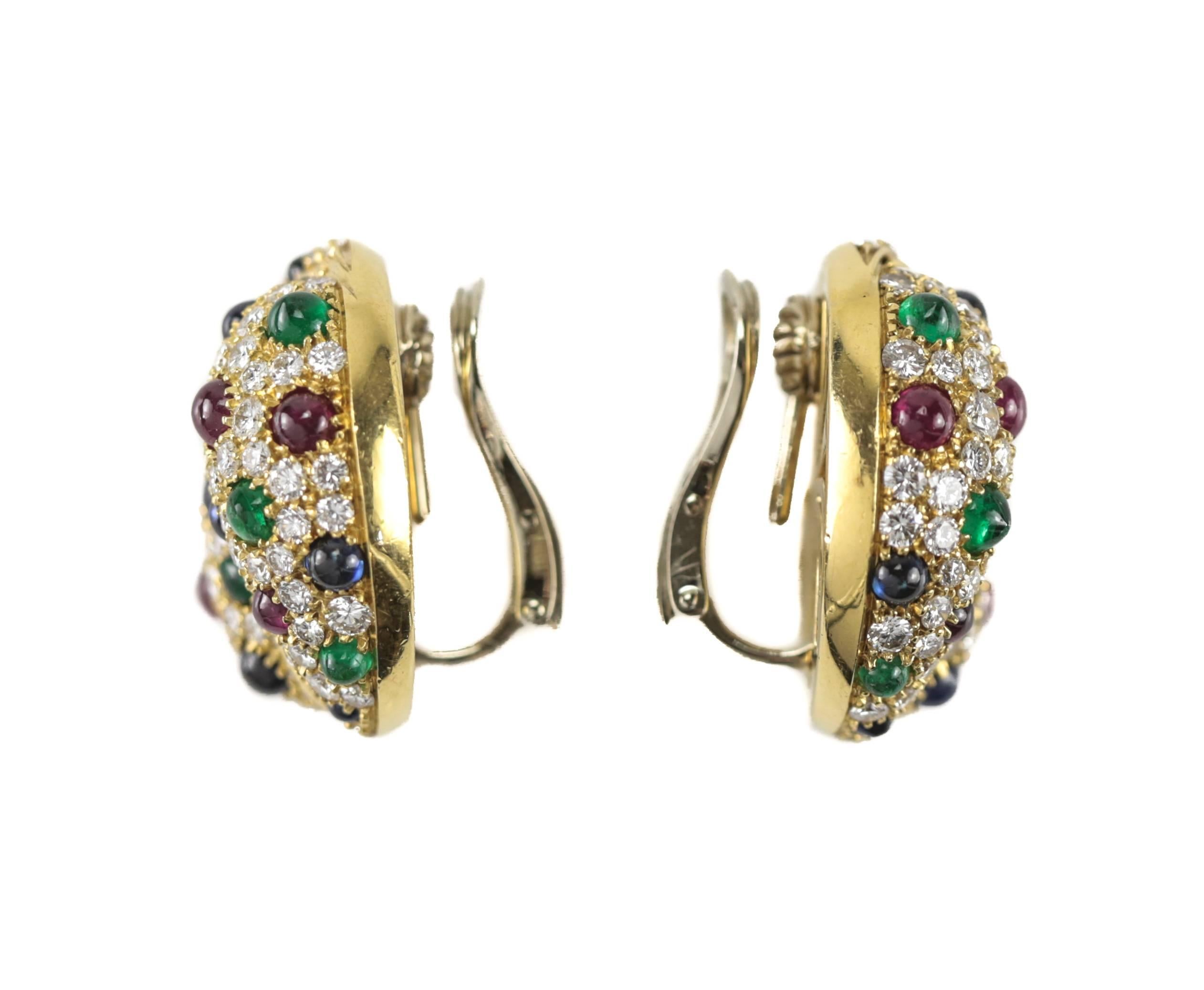 A stunning pair of earrings by Picchiotti, cast in 18-karat yellow gold in a dome design, each with approximately 92 pave set brilliant cut diamonds, six cabochon cut rubies, eight cabochon cut emeralds and eight cabochon cut sapphires. An applied