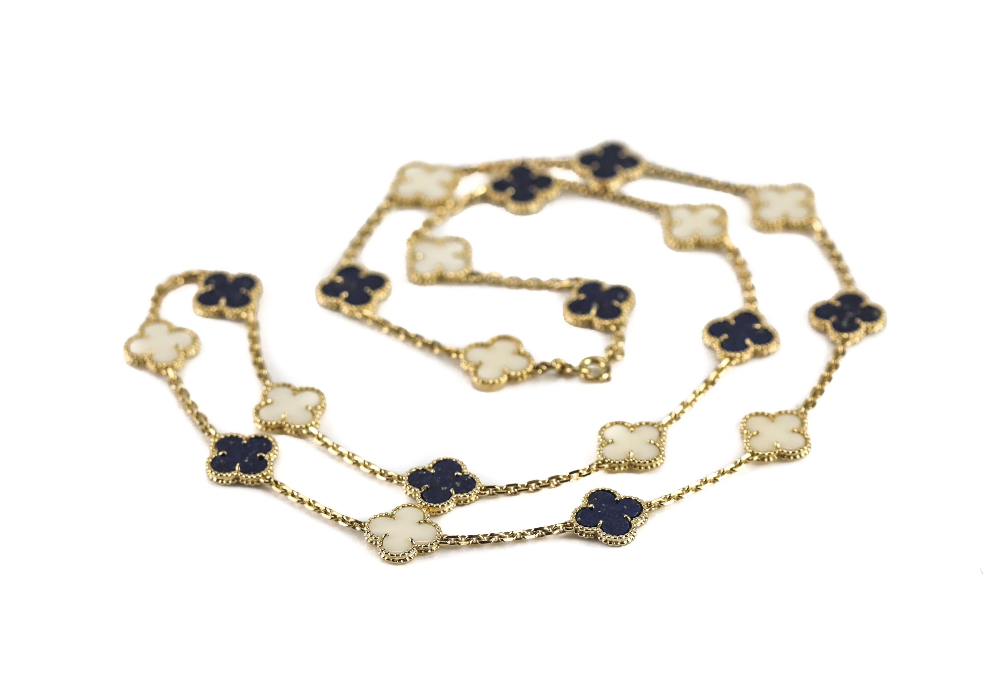 A vintage necklace by Van Cleef & Arpels from the Alhambra collection consisting of ten alternating clover motifs of white coral and lapis lazuli. Necklaces such as this are issued every once in a while as part of a limited edition series, it is our