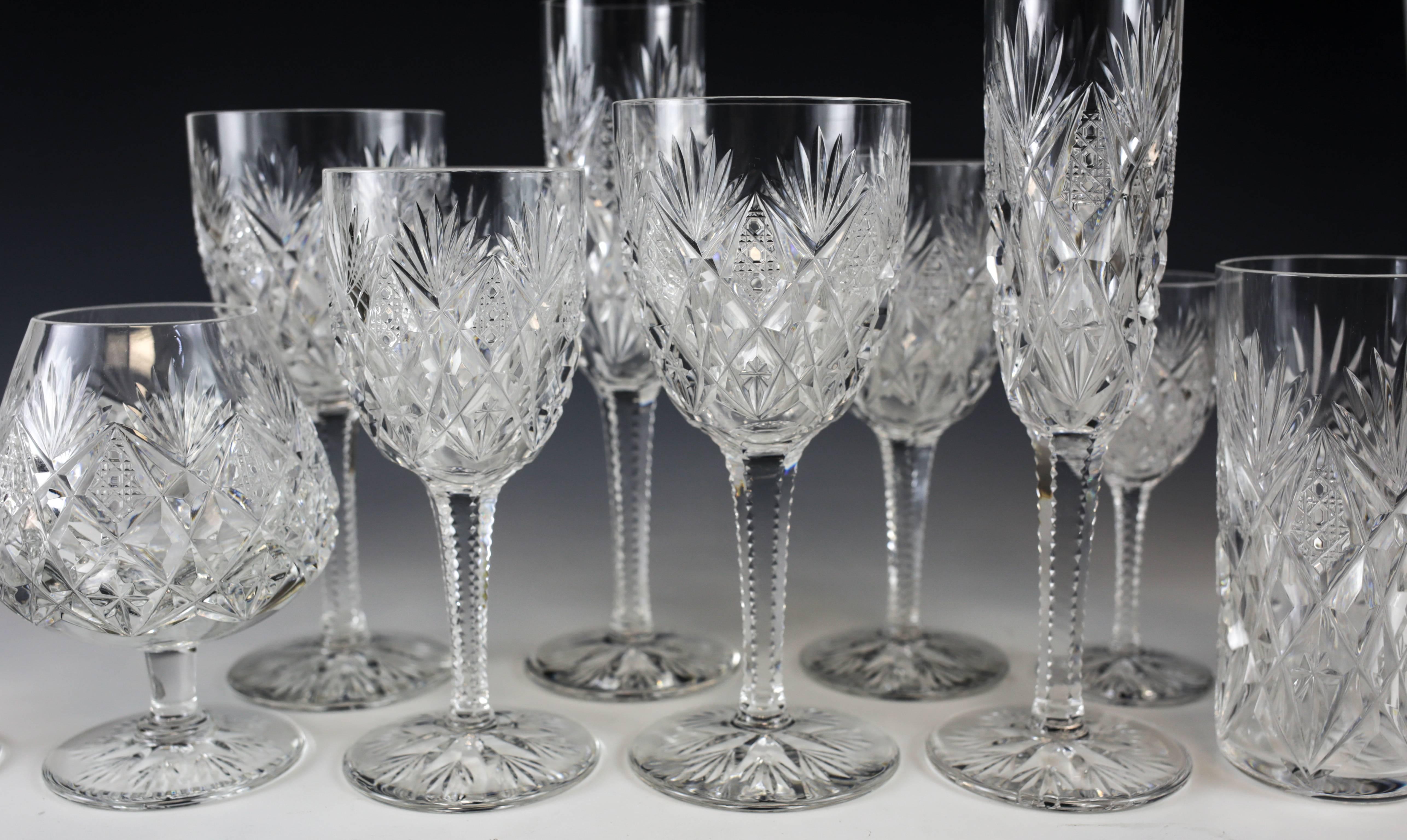 An exquisite stemware service for 12 by Saint Louis in the discontinued Florence pattern. Each piece is finely cut with an elegant fanned "pineapple" cut the stems and base are further cut for feel and aesthetics. 

The full service