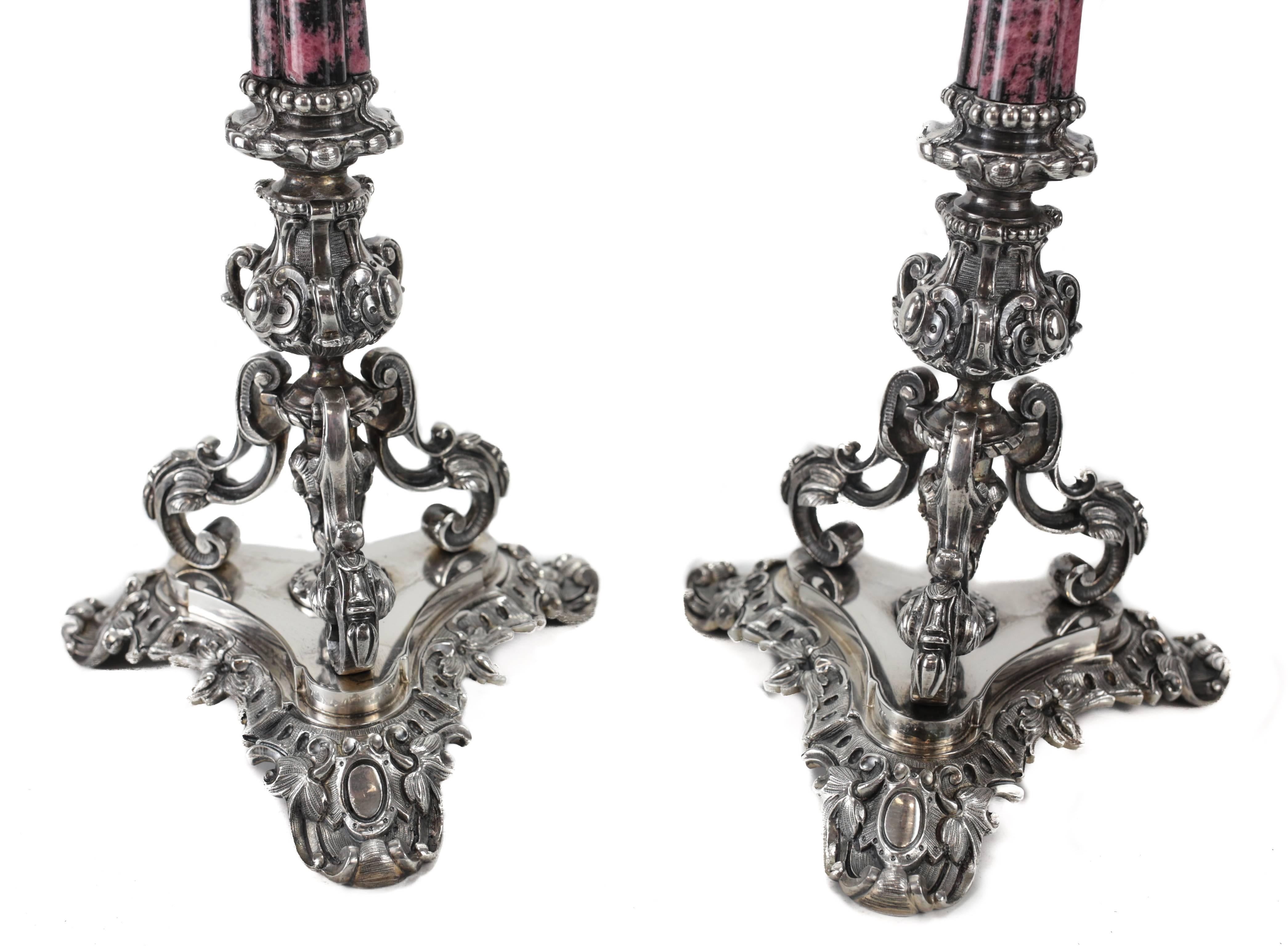 A large and magnificent pair of four-light candelabra crafted of .800 solid silver by Italian silversmith Ganci Carmelo di Giuseppe Morandino of Milan. Each candelabra with fine scrolled arms extended to each candle holder with a long stem of fine