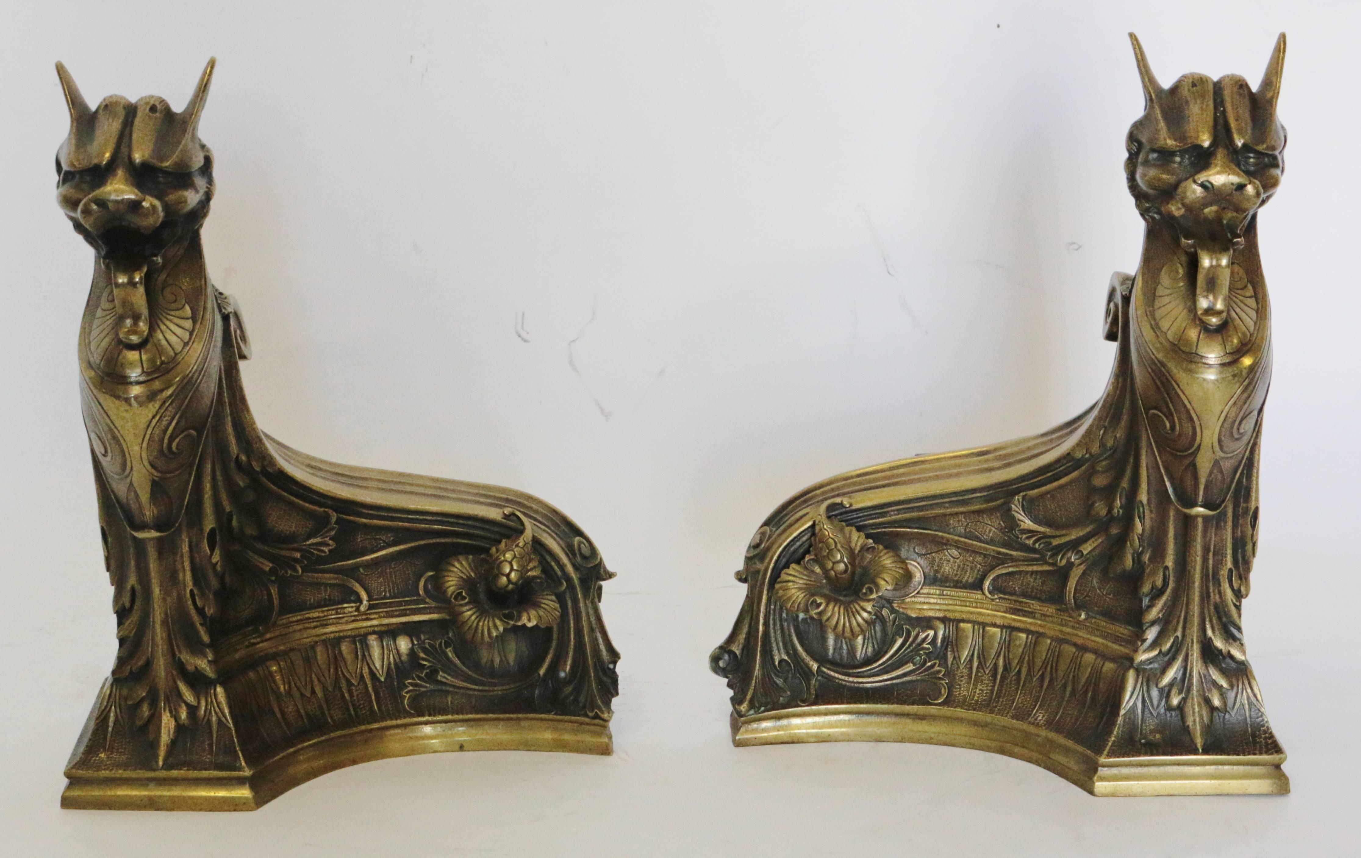 The ultimate Art Nouveau Gargoyle style motif. This amazing pair of French ormolu gargoyle like andirons have extra ordinary detail with great curves. The texture to the facial details provide exceptional feel as well to the chest plate. The drapes