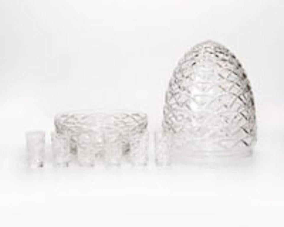 Contemporary
Each acid-etched maker mark of clear crystal, comprising an oviform presentoir, a circular caviar bowl and six tapering cylindrical vodka glasses, eight pieces.
Measure: the presentoir 12.5' H, 7.75' D
the bowl 1.90" by