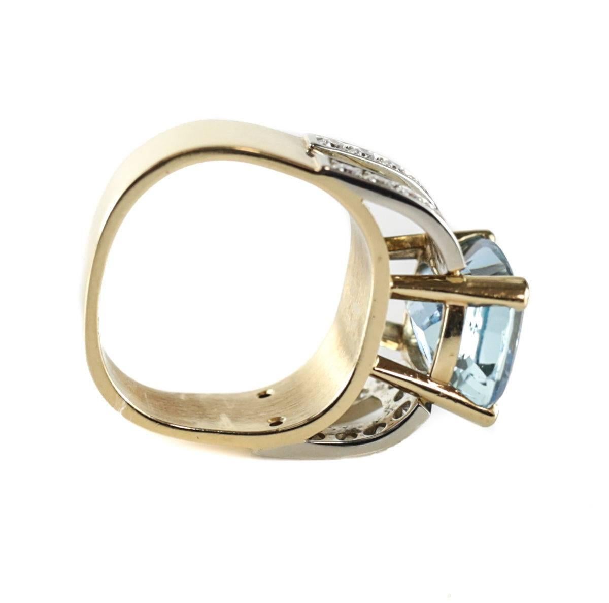 A stunning Jean-Francois Albert 18 karat yellow and white gold, diamond and 5 carat aquamarine signature fit ring. The beautiful aquamarine stone of a gem quality in medium light blue with moderately strong intensity in a rectangular cushion cut. 24