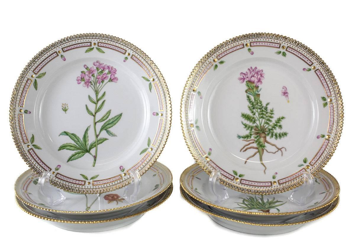 Eight Royal Copenhagen luncheon plates in Flora Danica. Each botanical identification in Latin on reverse. Printed factory mark numbered 604. Date code for 1992-1999.
