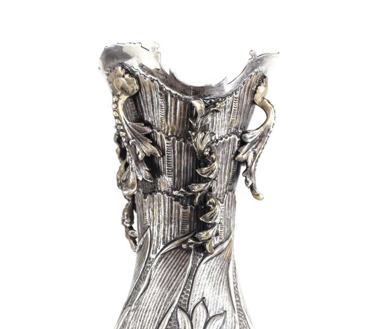 Continental 900 silver footed vase from the transitional Art Nouveau period. Niello throughout the hand-hammered vase with hand chased florals to the body and applied acanthus leaves towards the rim and base. Maker's mark 