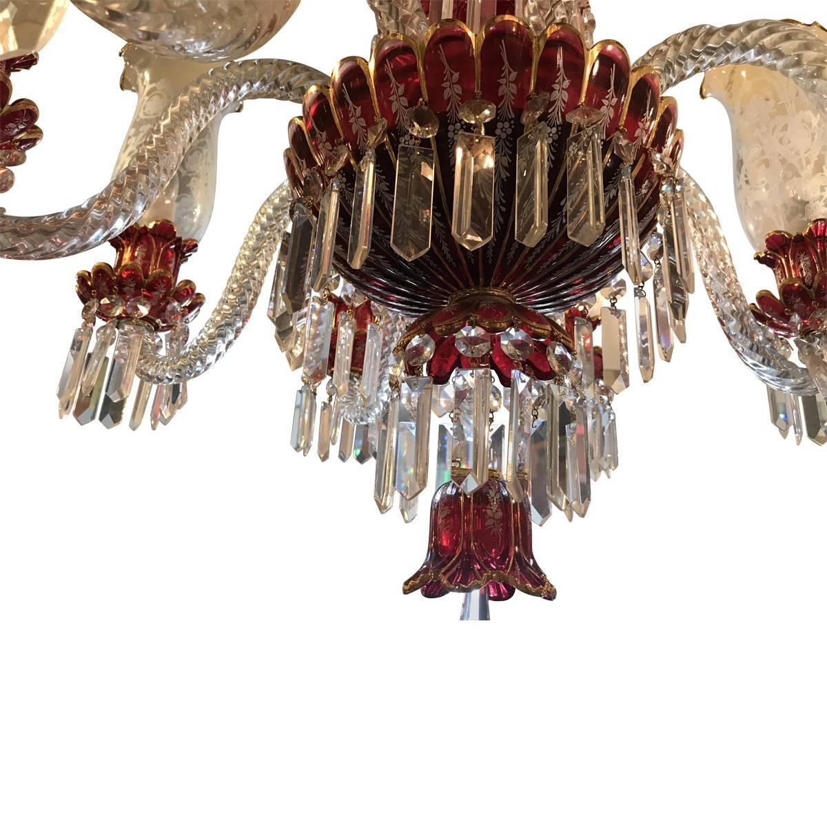 This beautiful Baccarat style bohemian chandelier combines traditional clear bohemian ruby glass crystals with bold colors. The cranberry red glass has a touch of elegance only this chandelier has to make a striking statement. Its beauty lies in its