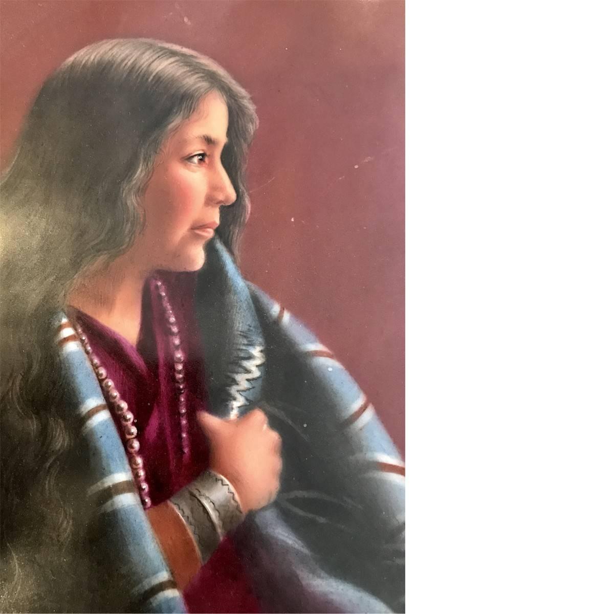 Colorful and rare, this eye-catching antique porcelain plaque depicts a portrait of a woman in traditional Native American garb. Tell tale signs of handmade woven blankets for trade as well as copper/silver bracelets made in the 19th century.