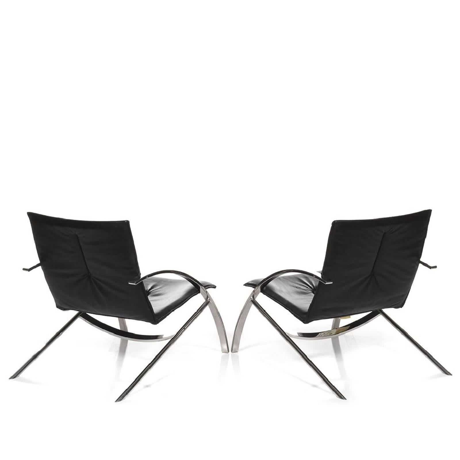 Pair of Modern midcentury Arco lounge chairs by Paul Tuttle for Arconas .
Paul Tuttle described this extremely comfortable chairs his best pieces, pure calligraphy . 
These lounge chairs feature a solid chrome metal frame with comfortable leather