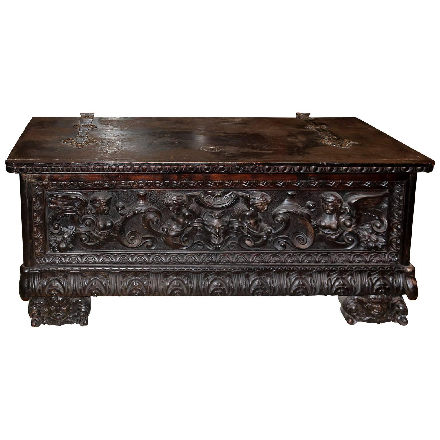 19th century monumental Baroque trunk is heavily hand-carved with Angels through out the entire body. The weighted handles are made from hand-forged iron as well as the hinges connecting the lid to the frame.

Contact us for shipping quotes.
 