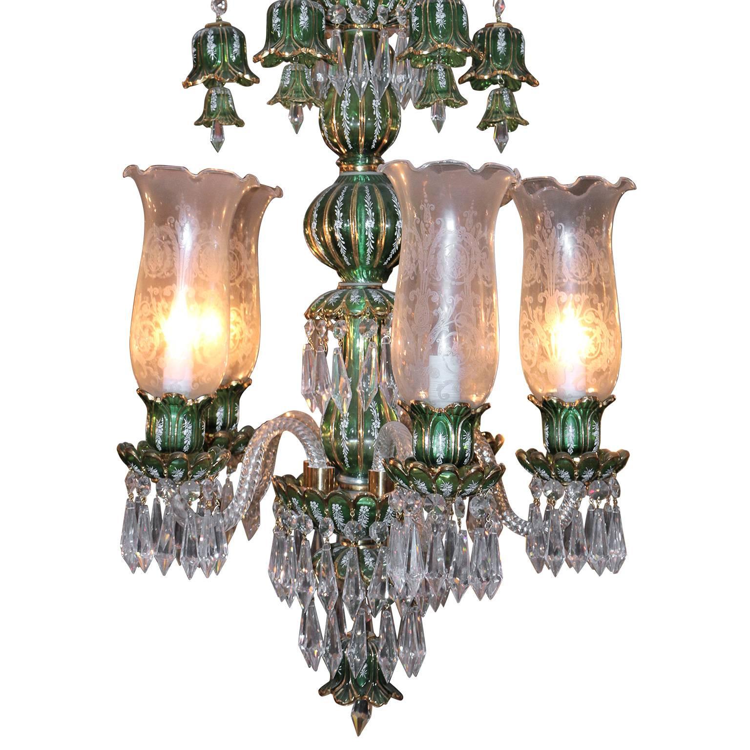 This classy Bohemian etched glass crystal. 

Emerald green two-tier chandelier has Bohemian etched glass crystals beautifully placed beneath each bottom tier tulip and blown glass covers. The top tier arms are made of Bohemian crystals allowing