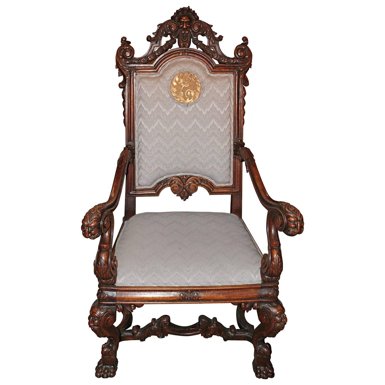 This great early 19th century Spanish hand-carved kings chair with emblem is in great condition. The hand-carved arms and legs have amazing patina. The details are all hand-carved with precision and skill. The centre piece of this beautiful chair is