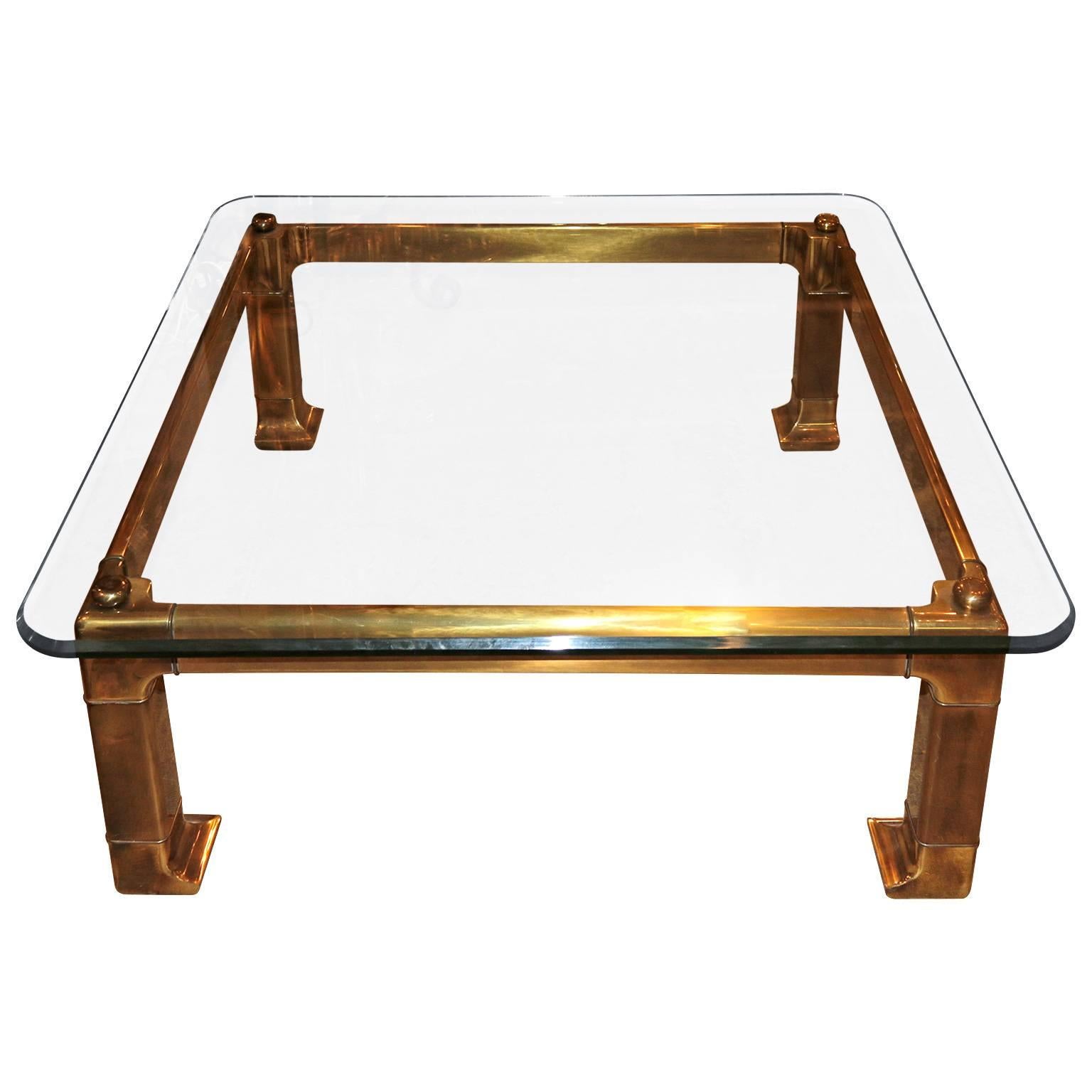 Stunning and beautiful brass coffee table designed and manufactured by Mastercraft.

The glass is original hand cut double thick beveled glass. Amazing condition.
