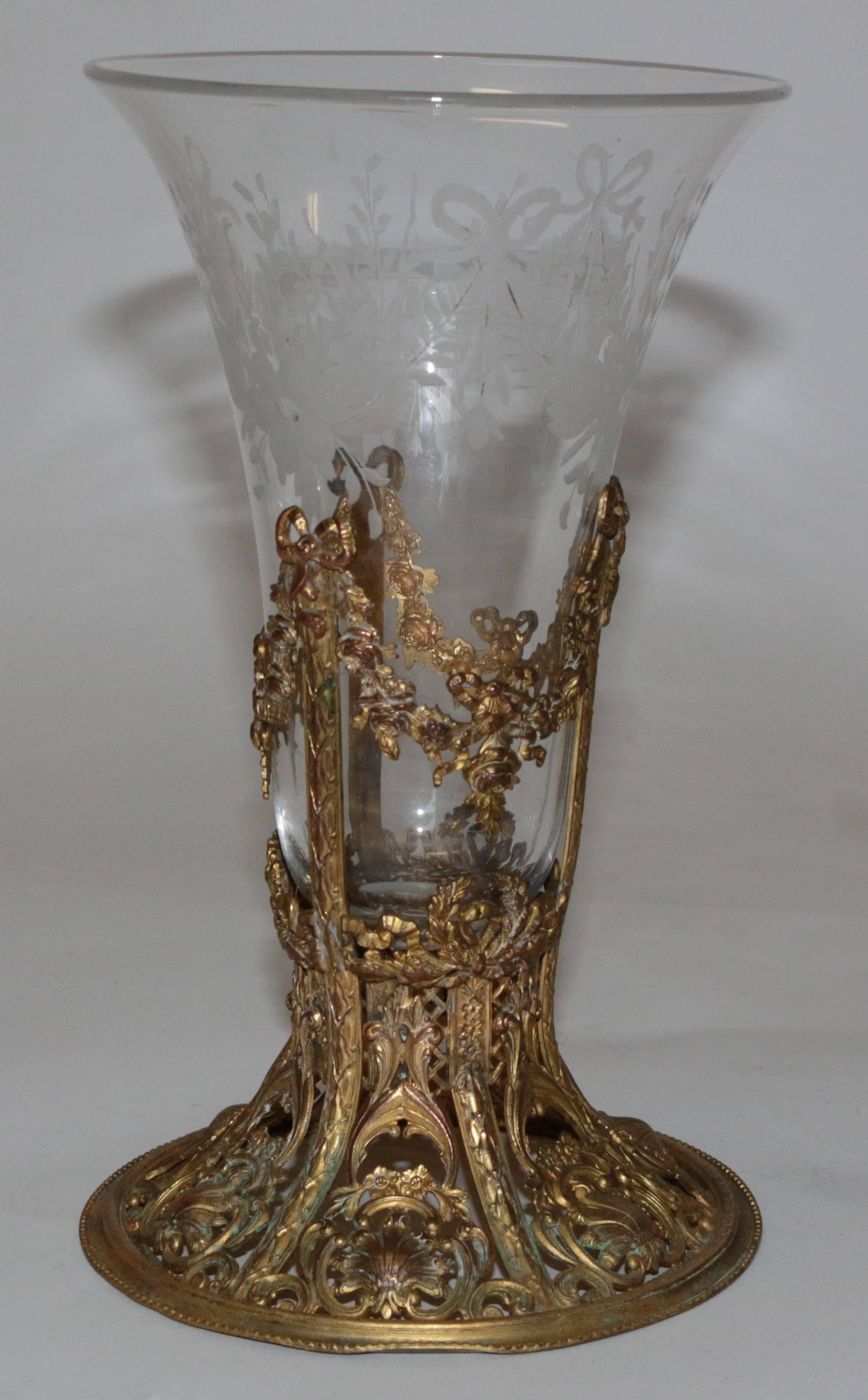 This great etched blown glass and ormolu base are in pristine condition. The ormolu base has amazing detail with ribbons at the top of the base extending through rose vines. There are shells at the bottom of the base giving it a great festooned look.