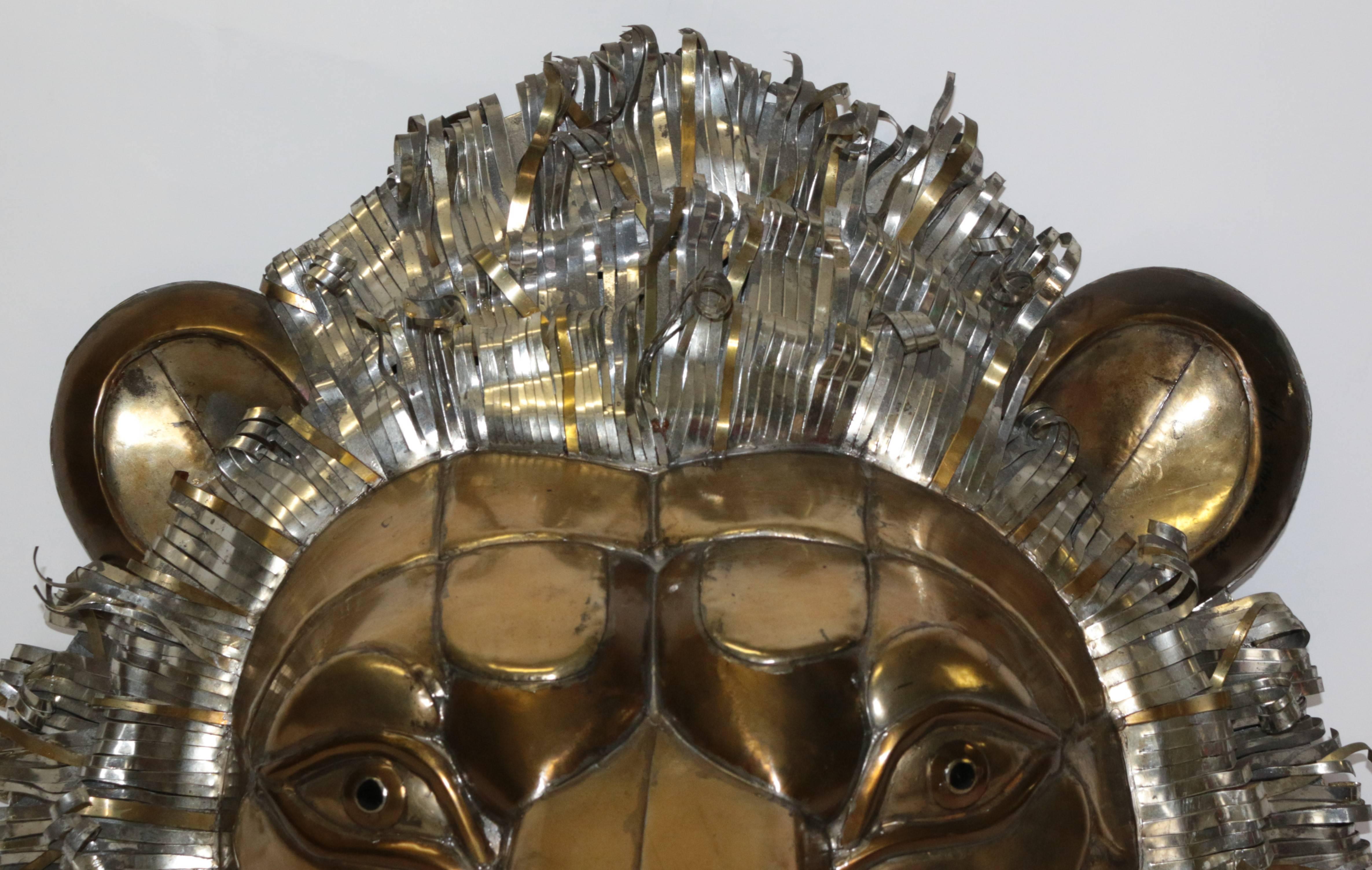 World renowned Mexican artist Sergio Bustamante signed Lion Head made from sheet metal and copper. This monumental lion head is and amazing representation of Sergio's work. Extremely dedicated to the true look and nature of all his handmade items.