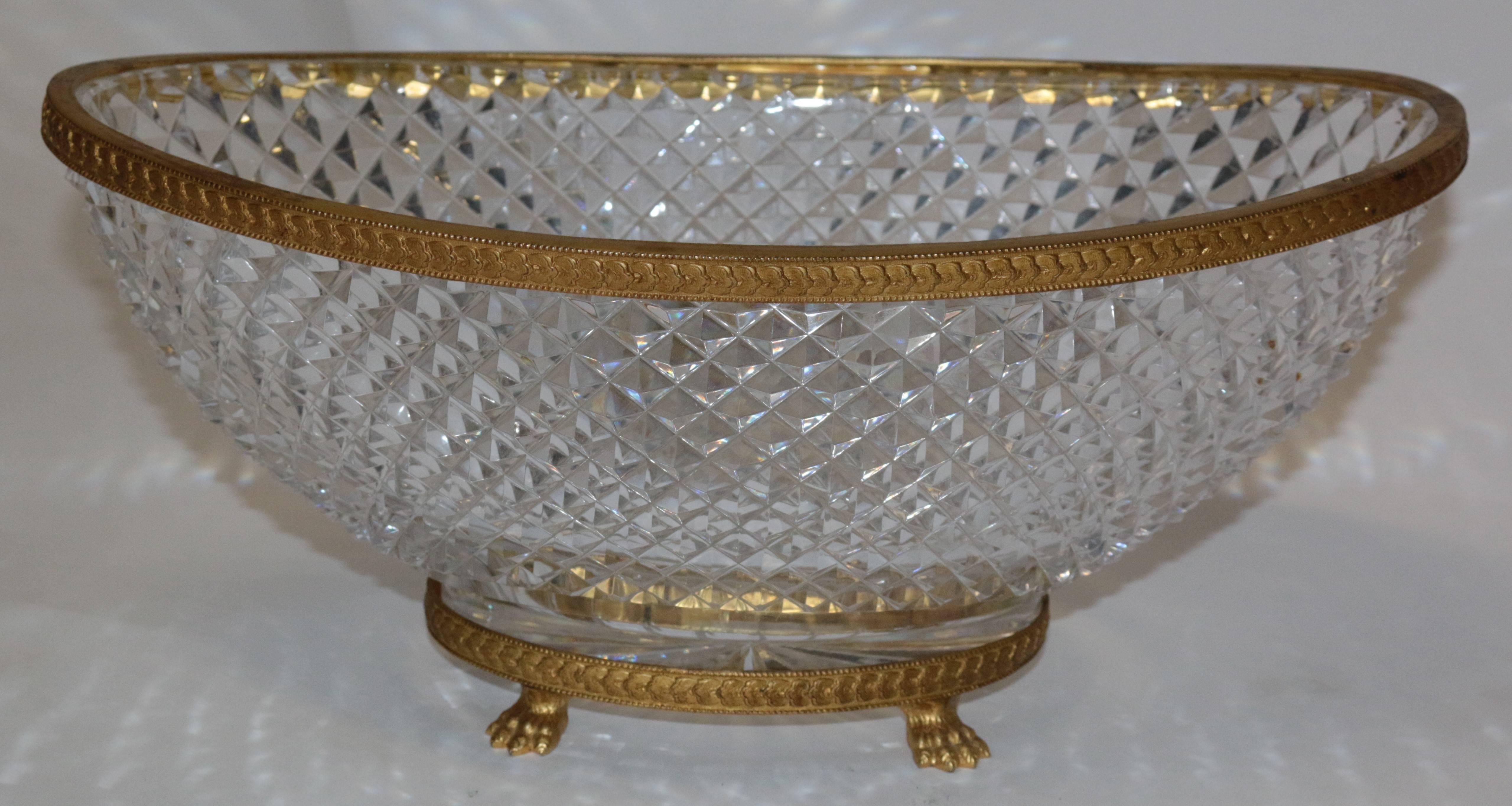 This elegant 19th century hand diamond cut Baccarat crystal and gilt bronze centerpiece is diamond cut crystal mounted on bronze. The crystal is a Baccarat fine crystal.