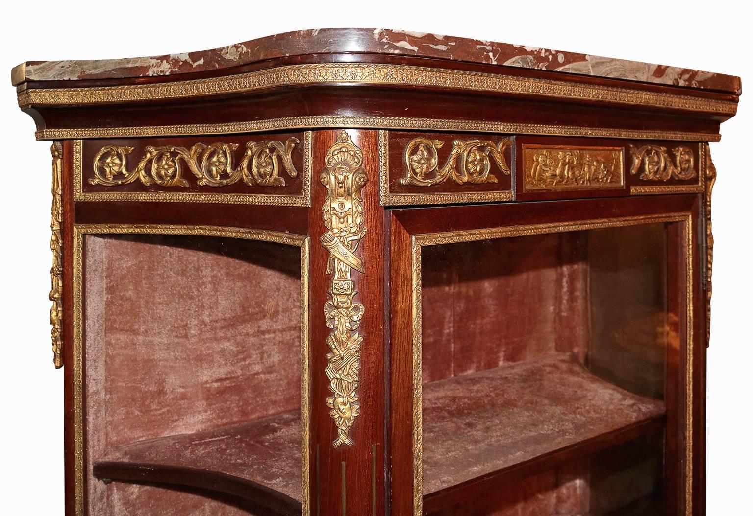 This beautiful 19th century vitrine has three shelves, marble-top, bronze ormolu lining, with curved glass on each side. All three of the bottom panels are hand-painted portrait in excellent used condition. The middle portrait is of a poet and his