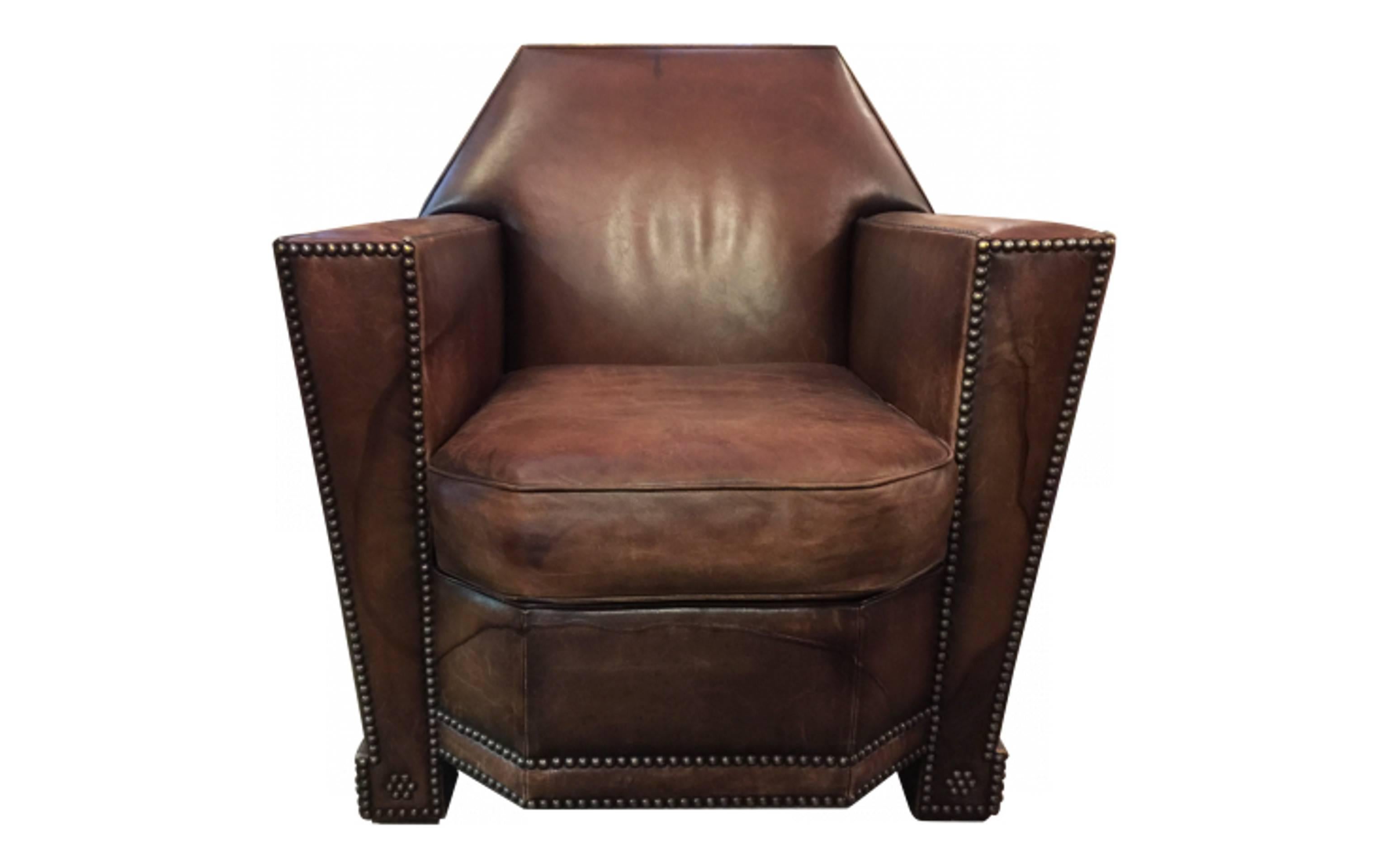 Impressive naturally distress leather Art Deco cigar club chair decorated with studs all through the arms and legs of this chair. From the back of the seat to the front is 24 inches. By Ralph Lauren.