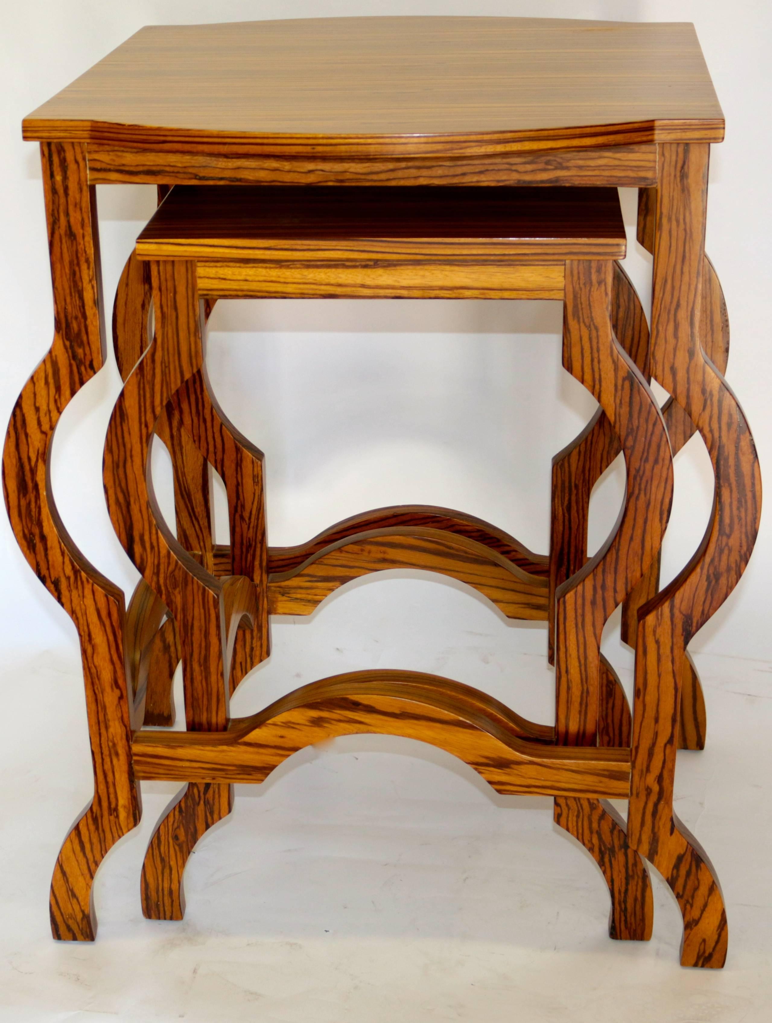 This elegant modern zebra wood nesting table/side tables are in excellent used condition with beautiful curved frame.
Measurements on the smaller table:
Measures: 28 H
13.5 W
20 D.