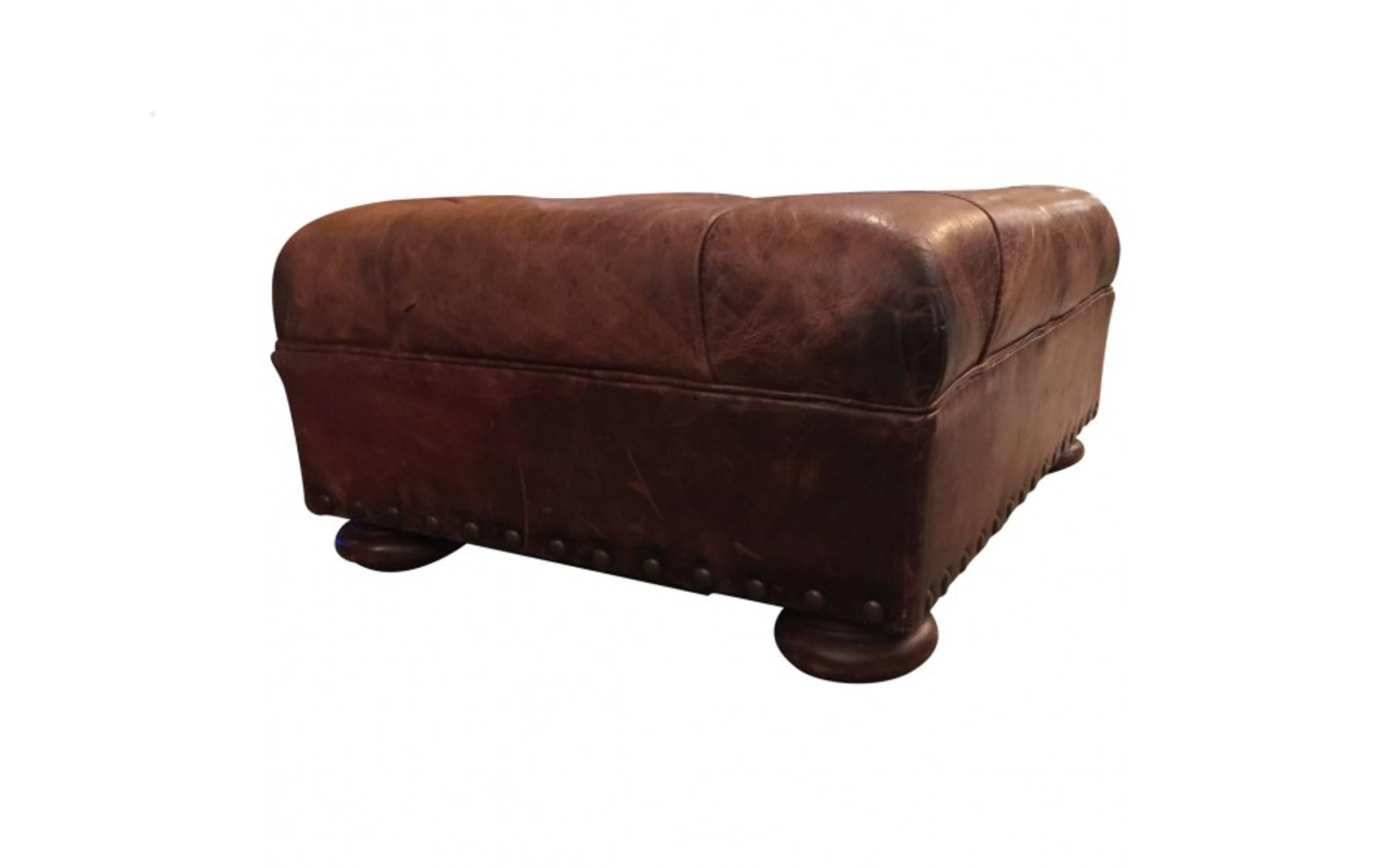 Ralph Lauren’s home furnishings and accessories reflect an enduring American style and the same level of craftsmanship synonymous with his clothing. This ottoman is upholstered in tawny distressed leather that is tufted along the top and held by
